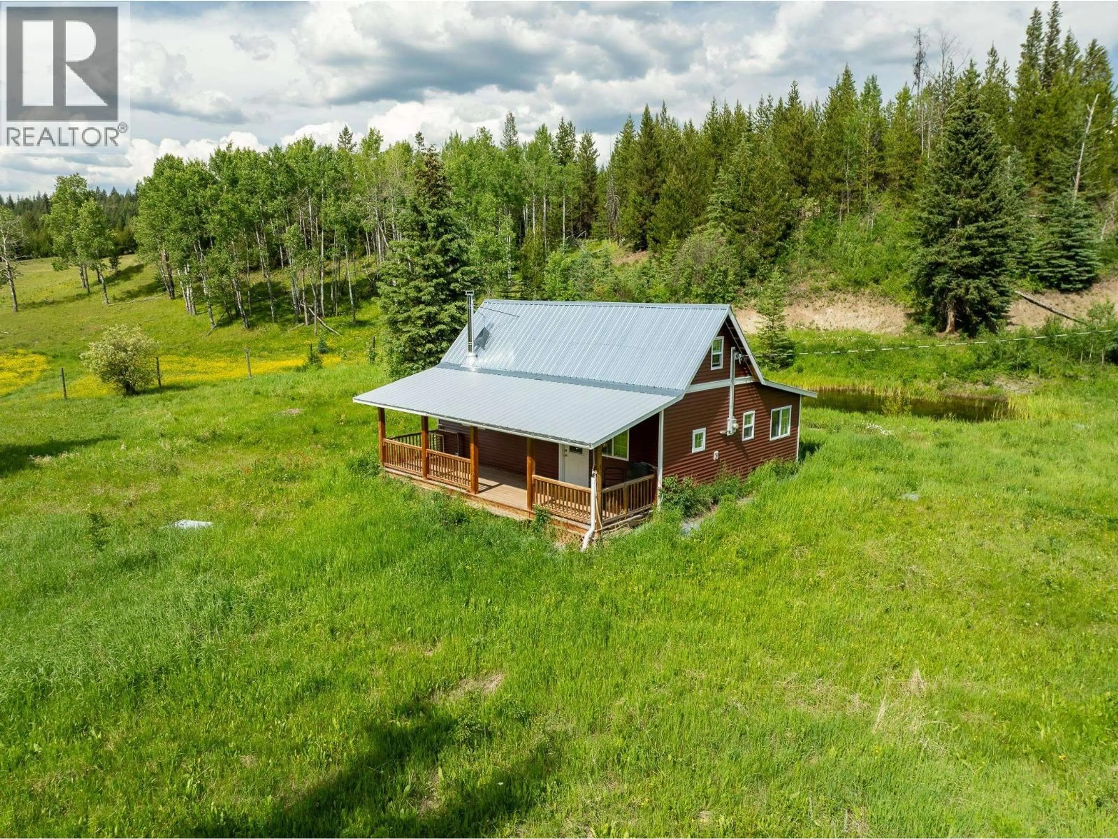 A pic from outside/outdoor area/front of a property/back of a property/a pic from drone, unknown for 6665 JUDSON ROAD, Bridge Lake British Columbia V0K1X3