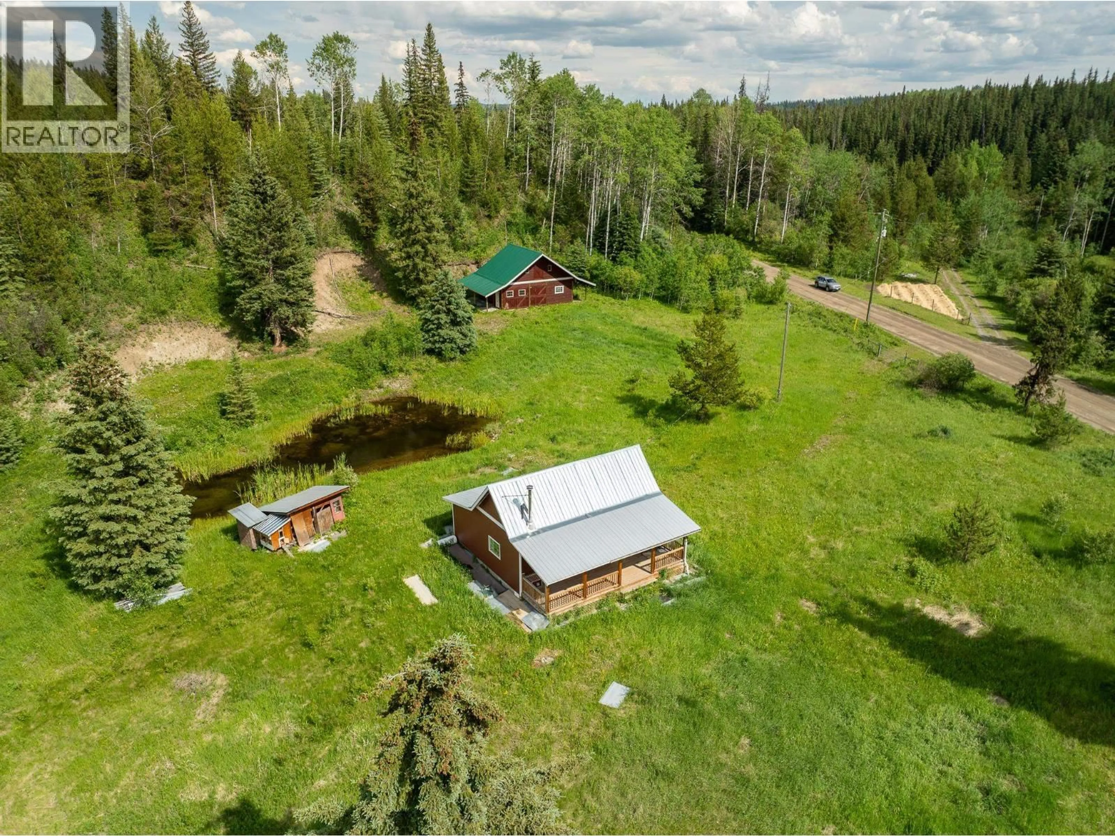 A pic from outside/outdoor area/front of a property/back of a property/a pic from drone, unknown for 6665 JUDSON ROAD, Bridge Lake British Columbia V0K1X3