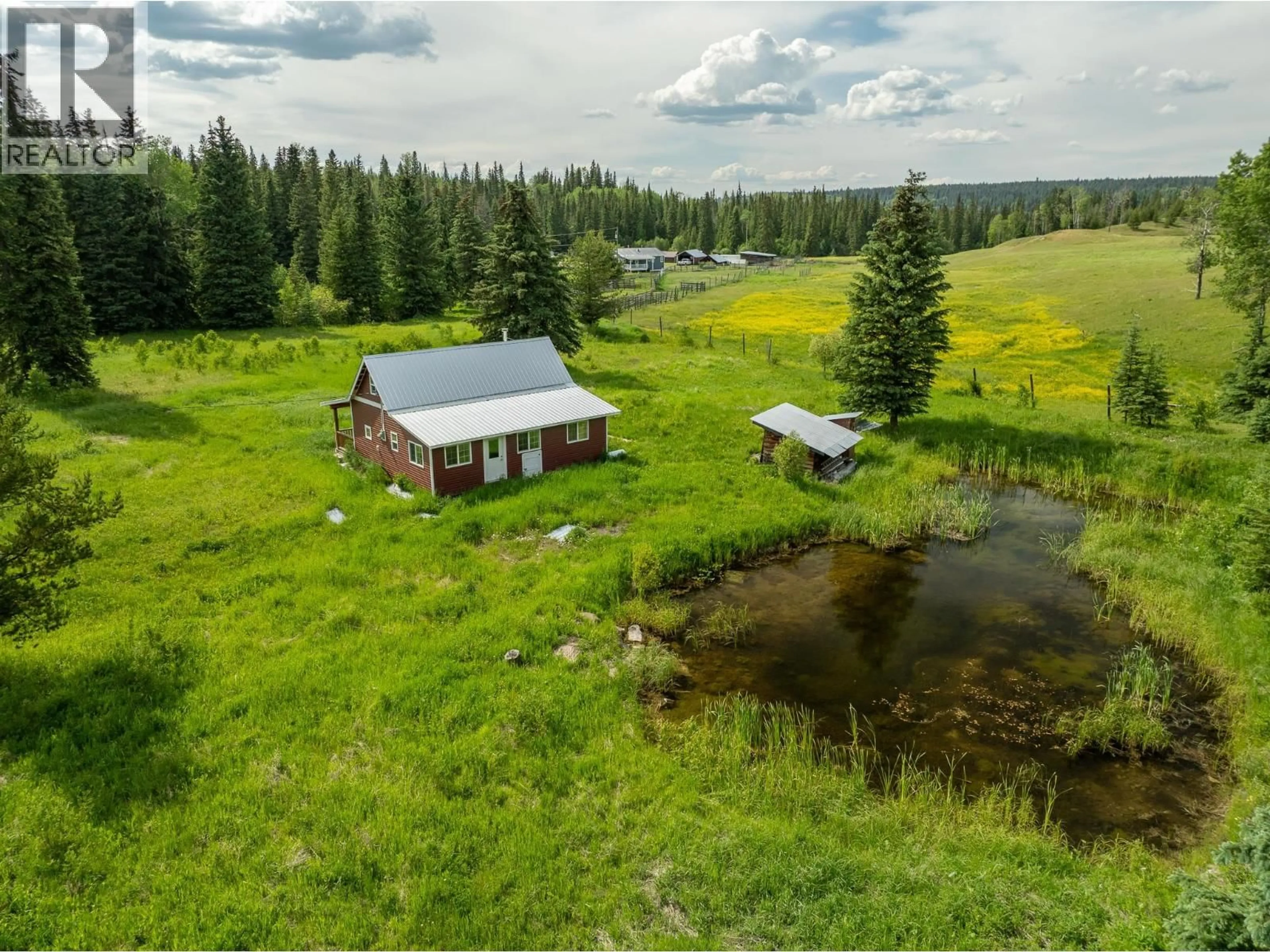 A pic from outside/outdoor area/front of a property/back of a property/a pic from drone, water/lake/river/ocean view for 6665 JUDSON ROAD, Bridge Lake British Columbia V0K1X3