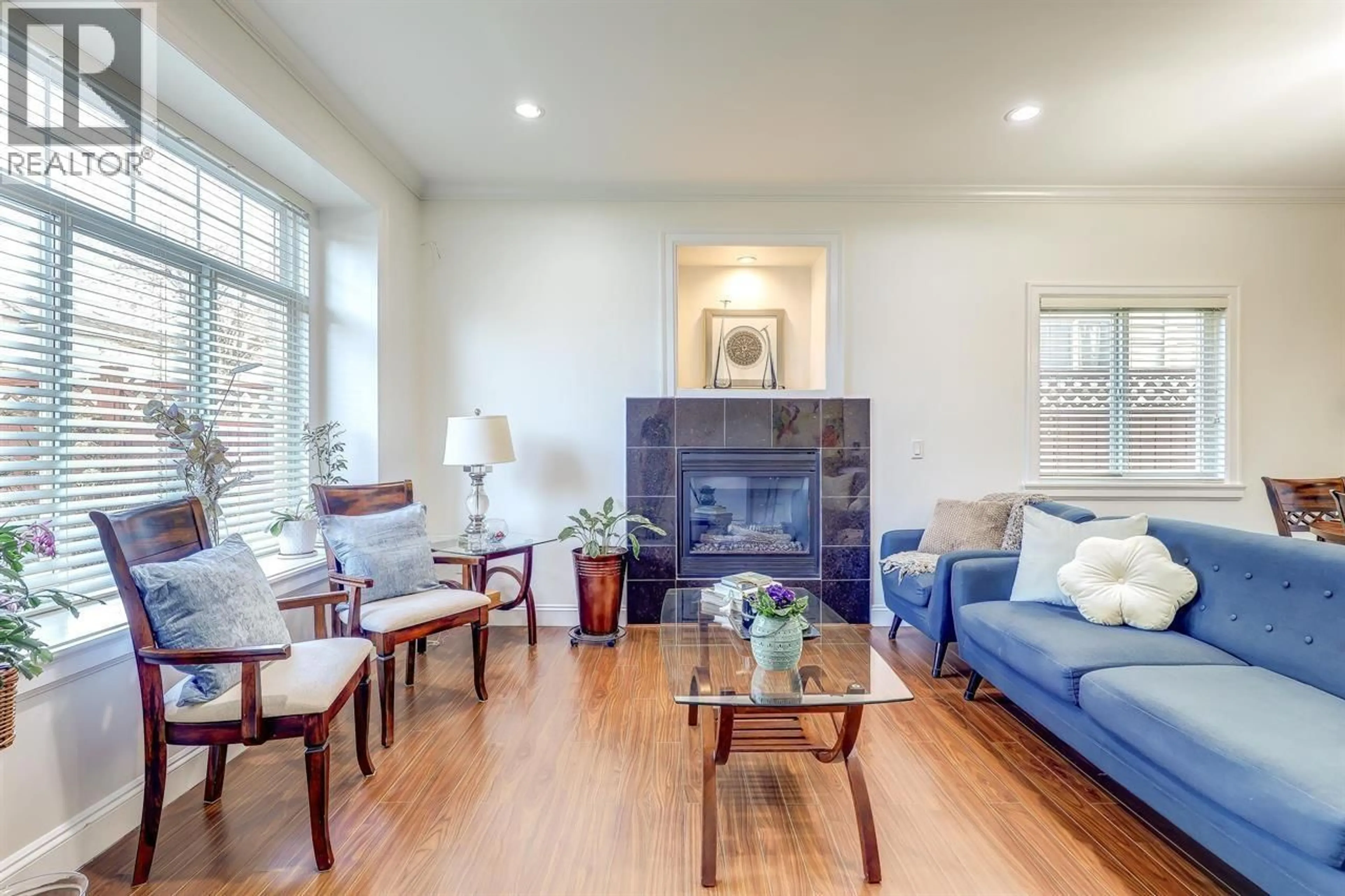 Living room with furniture, wood/laminate floor for 7448 17TH AVENUE, Burnaby British Columbia V3N1L4