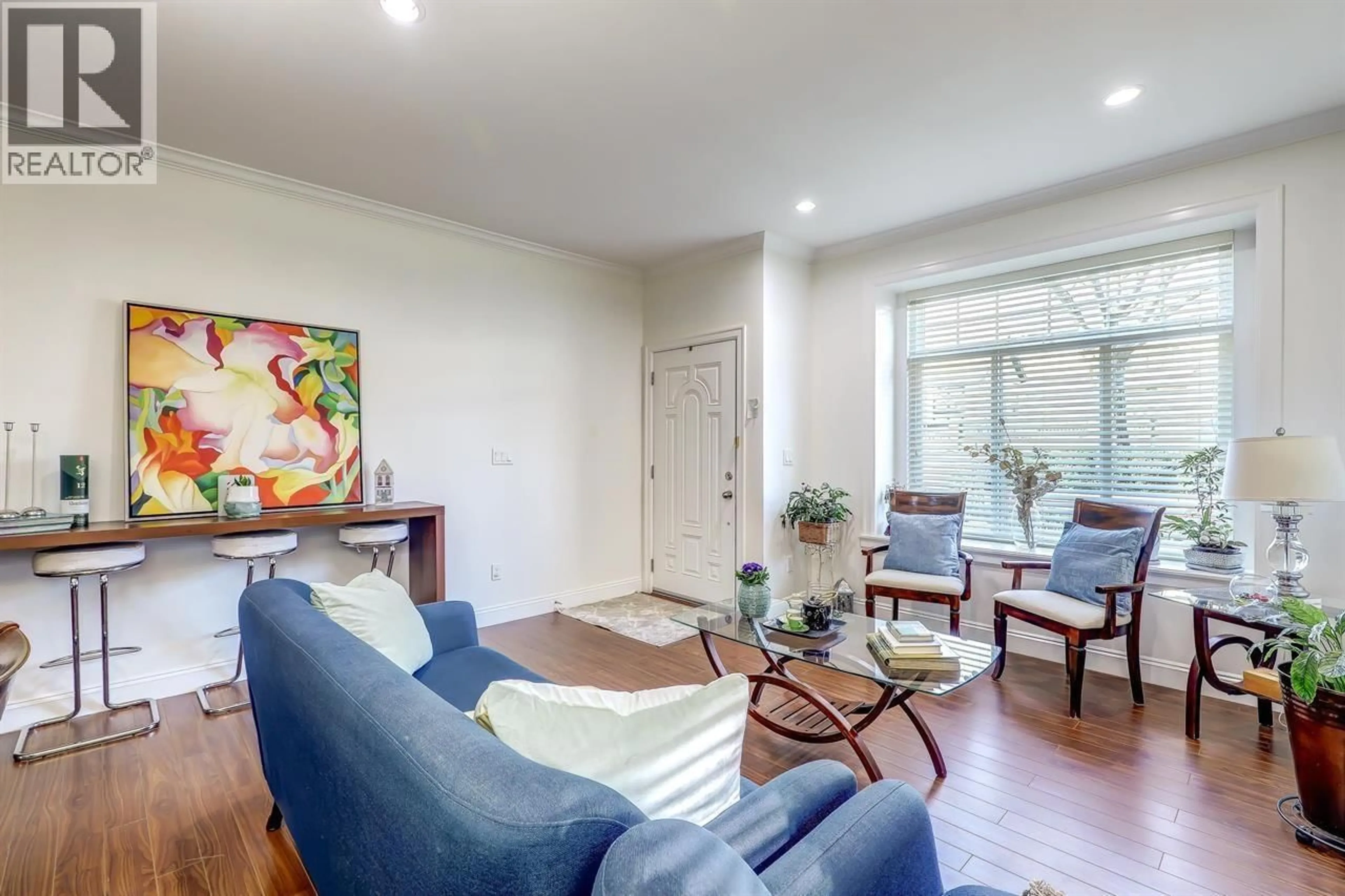 Living room with furniture, wood/laminate floor for 7448 17TH AVENUE, Burnaby British Columbia V3N1L4