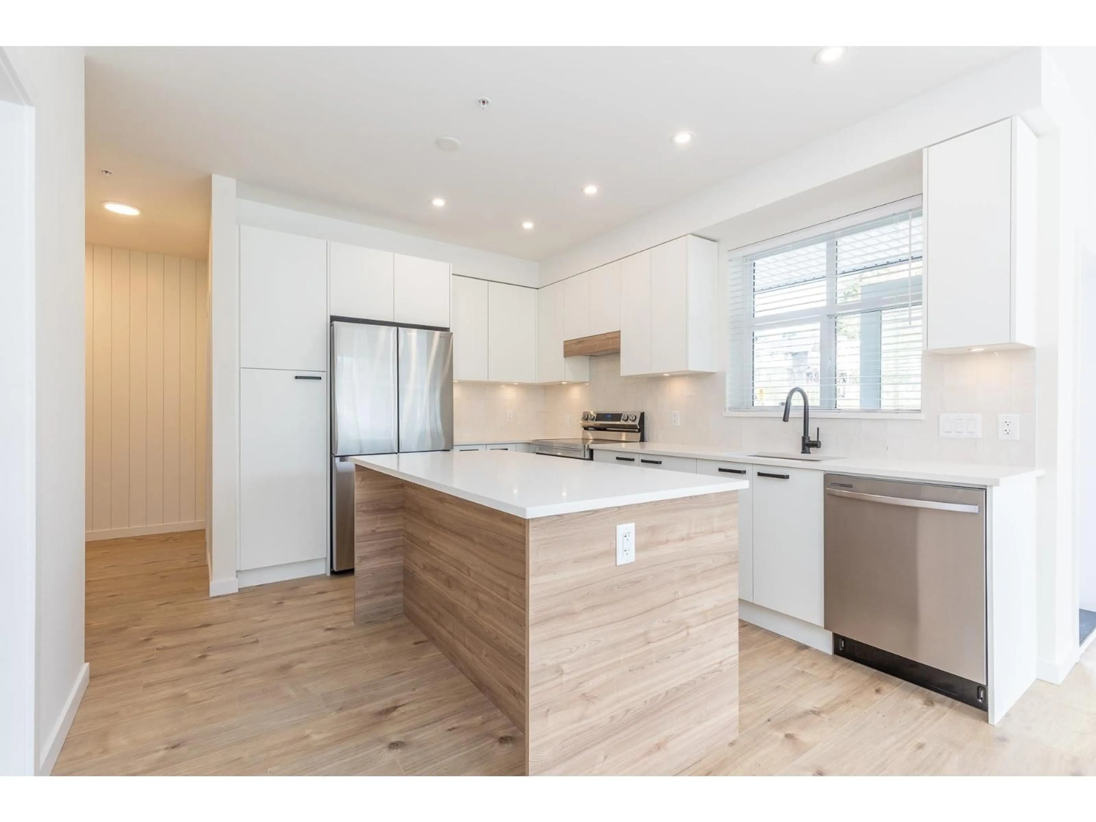 Open concept kitchen, wood/laminate floor for 112 - 33920 BEST AVENUE, Mission British Columbia V2V0L9