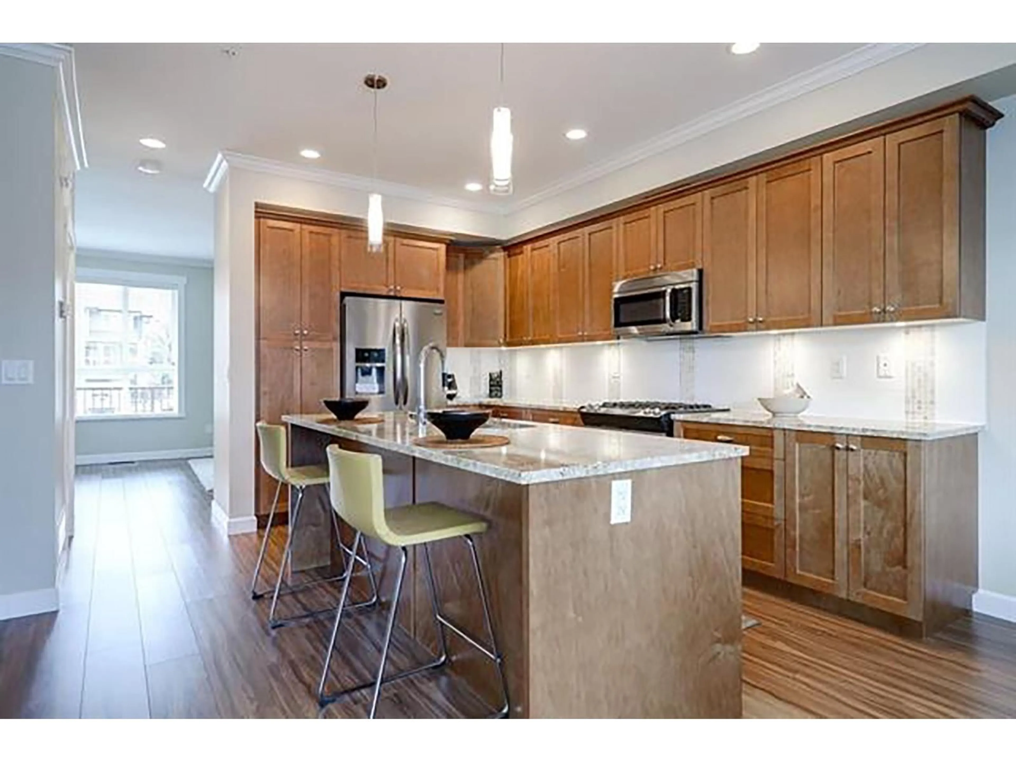 Open concept kitchen, wood/laminate floor for 5 - 7157 210 STREET, Langley British Columbia V2Y0T3