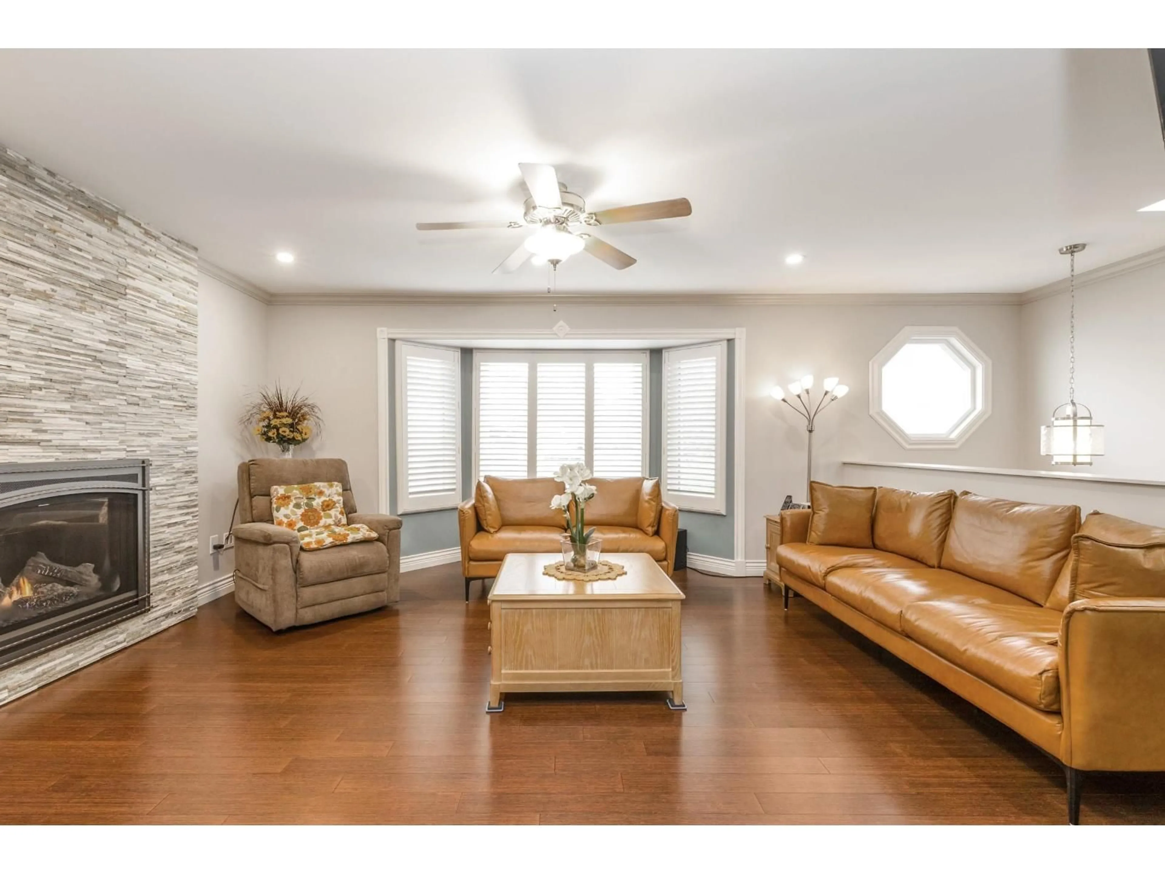 Living room with furniture, wood/laminate floor for 13251 82B AVENUE, Surrey British Columbia V3W0P9