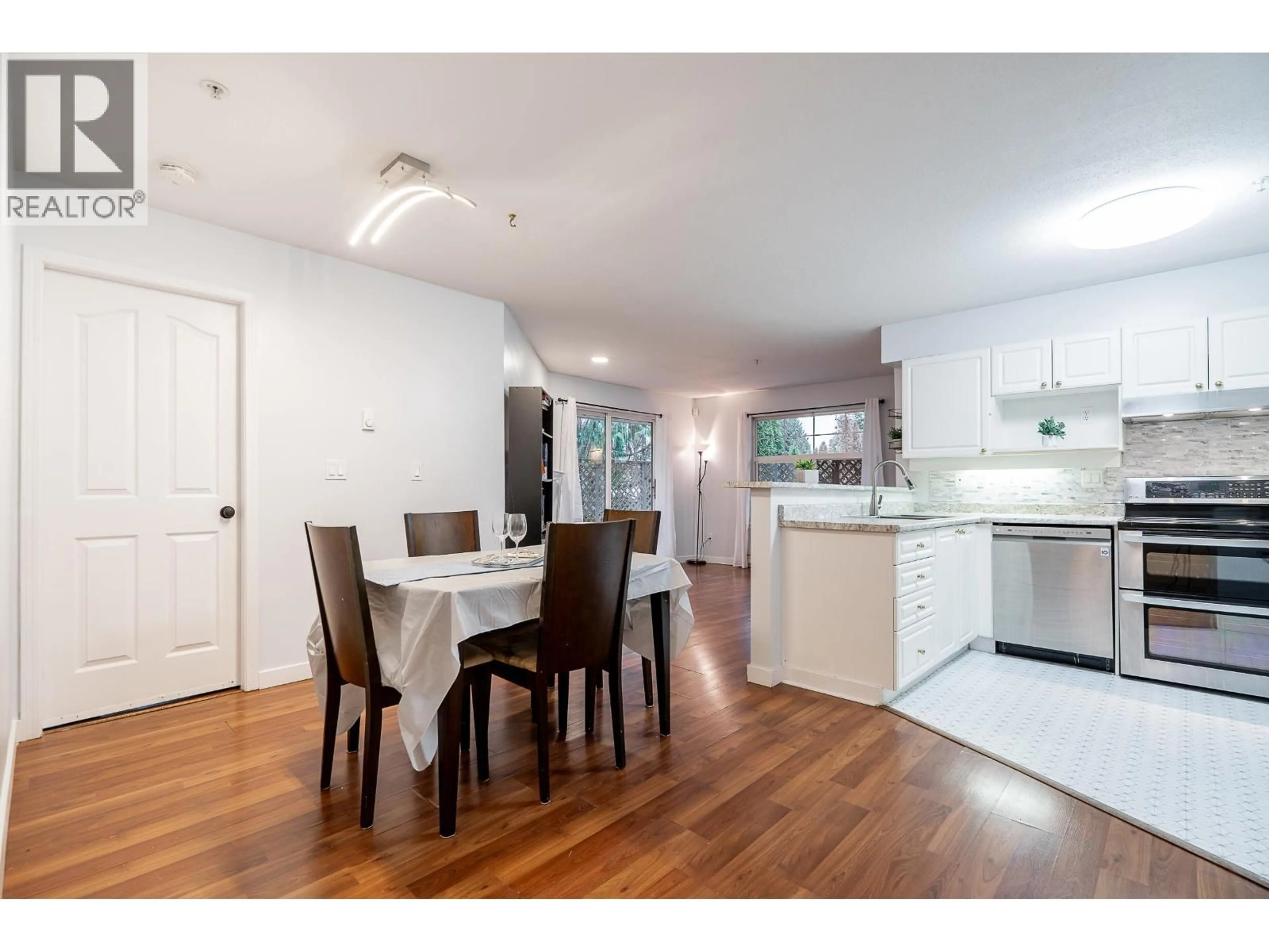 Open concept kitchen, wood/laminate floor for 105 - 1618 GRANT AVENUE, Port Coquitlam British Columbia V3B1P3