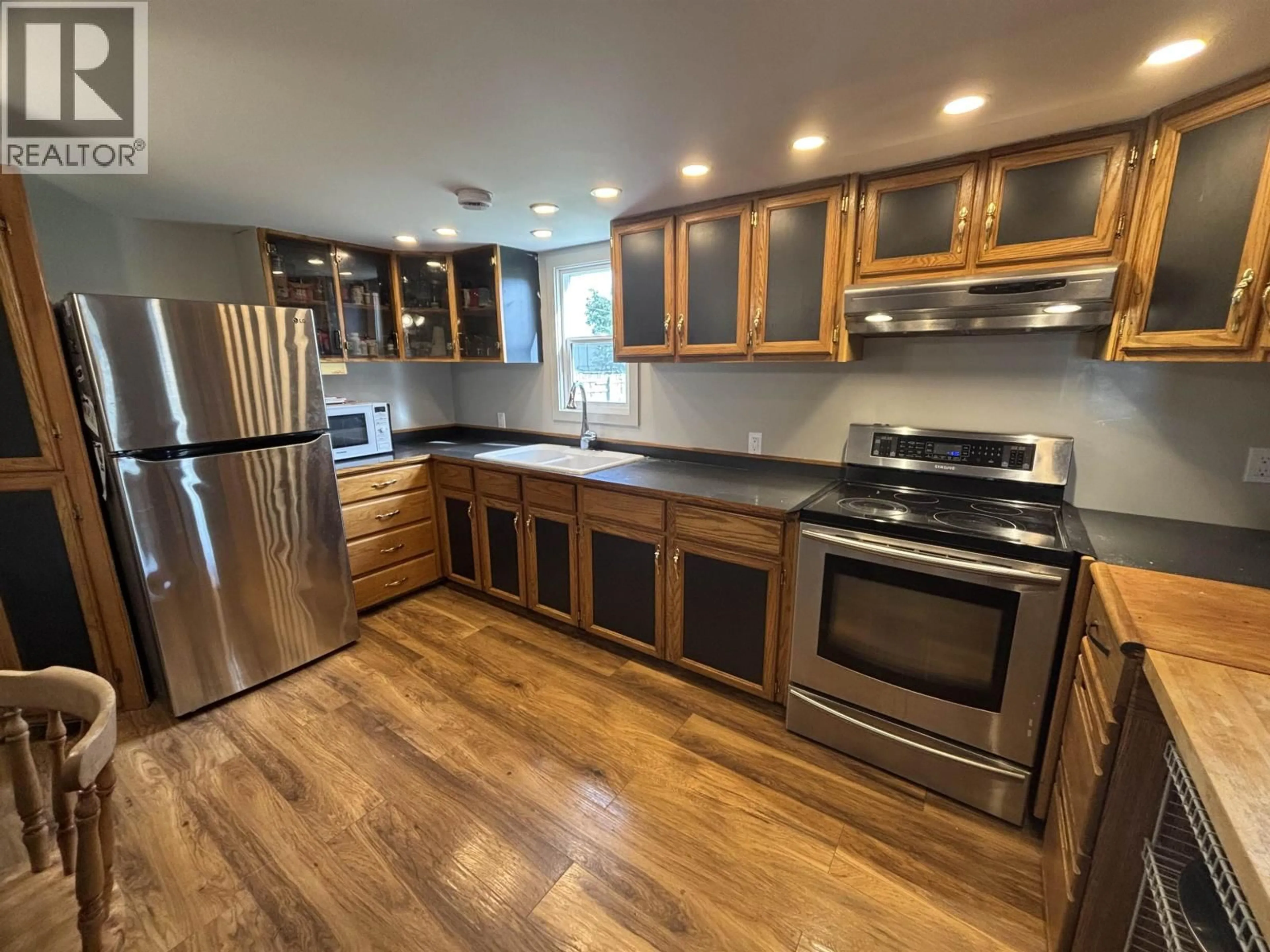 Open concept kitchen, wood/laminate floor for 69 - 5130 NORTH NECHAKO ROAD, Prince George British Columbia V2K4W3