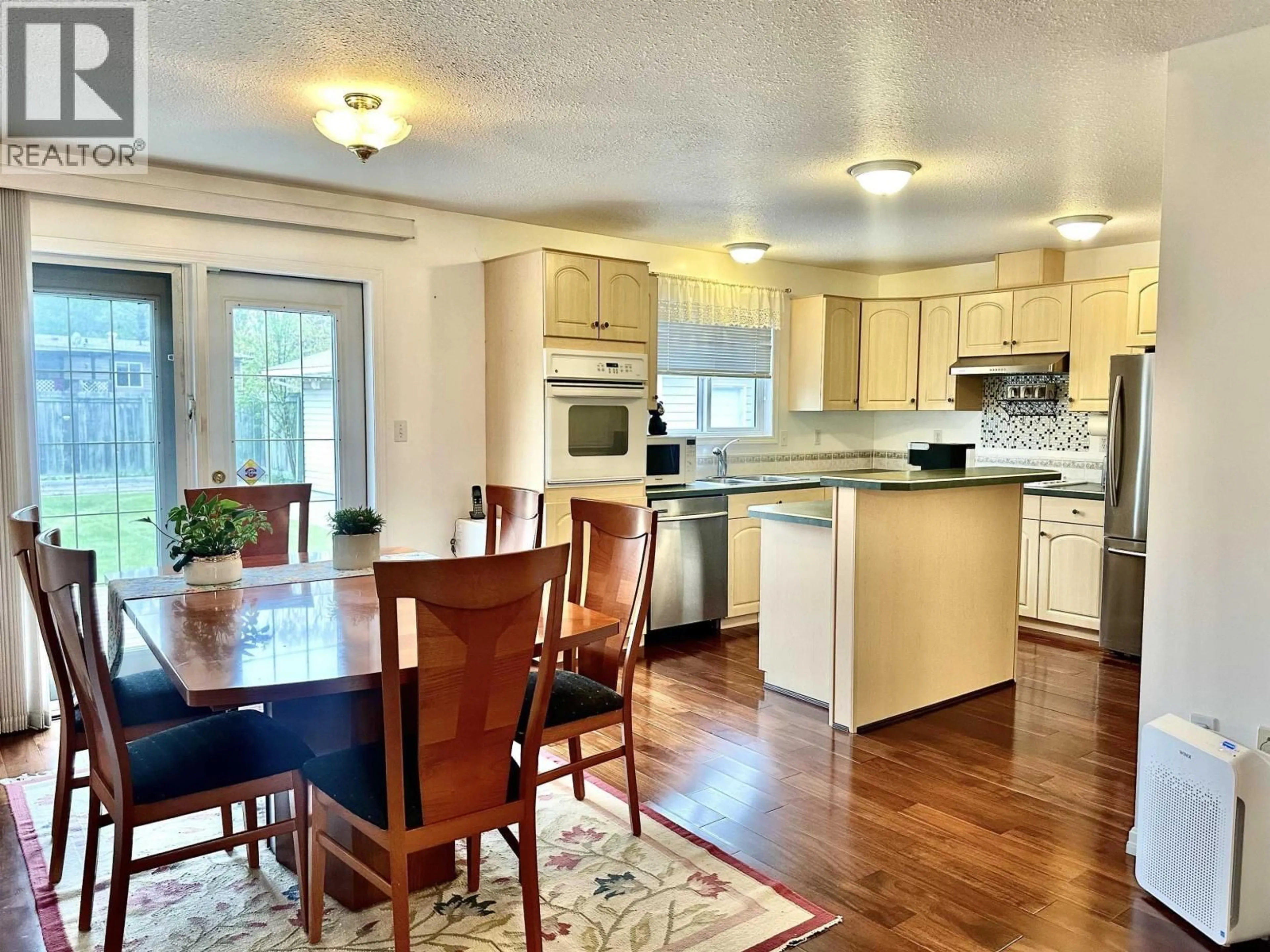Open concept kitchen, wood/laminate floor for 205 DOGWOOD STREET, Valemount British Columbia V0E2Z0