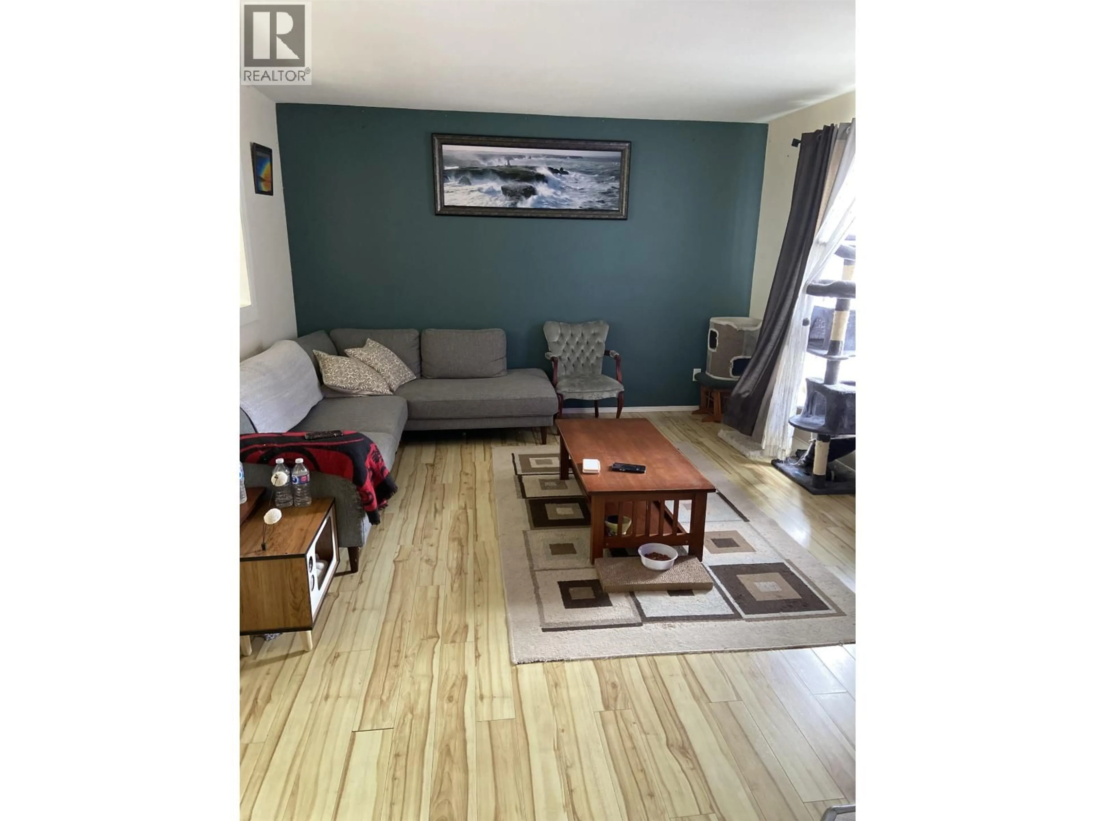 Living room with furniture, wood/laminate floor for 5137 MEDEEK AVENUE, Terrace British Columbia V8G1C9