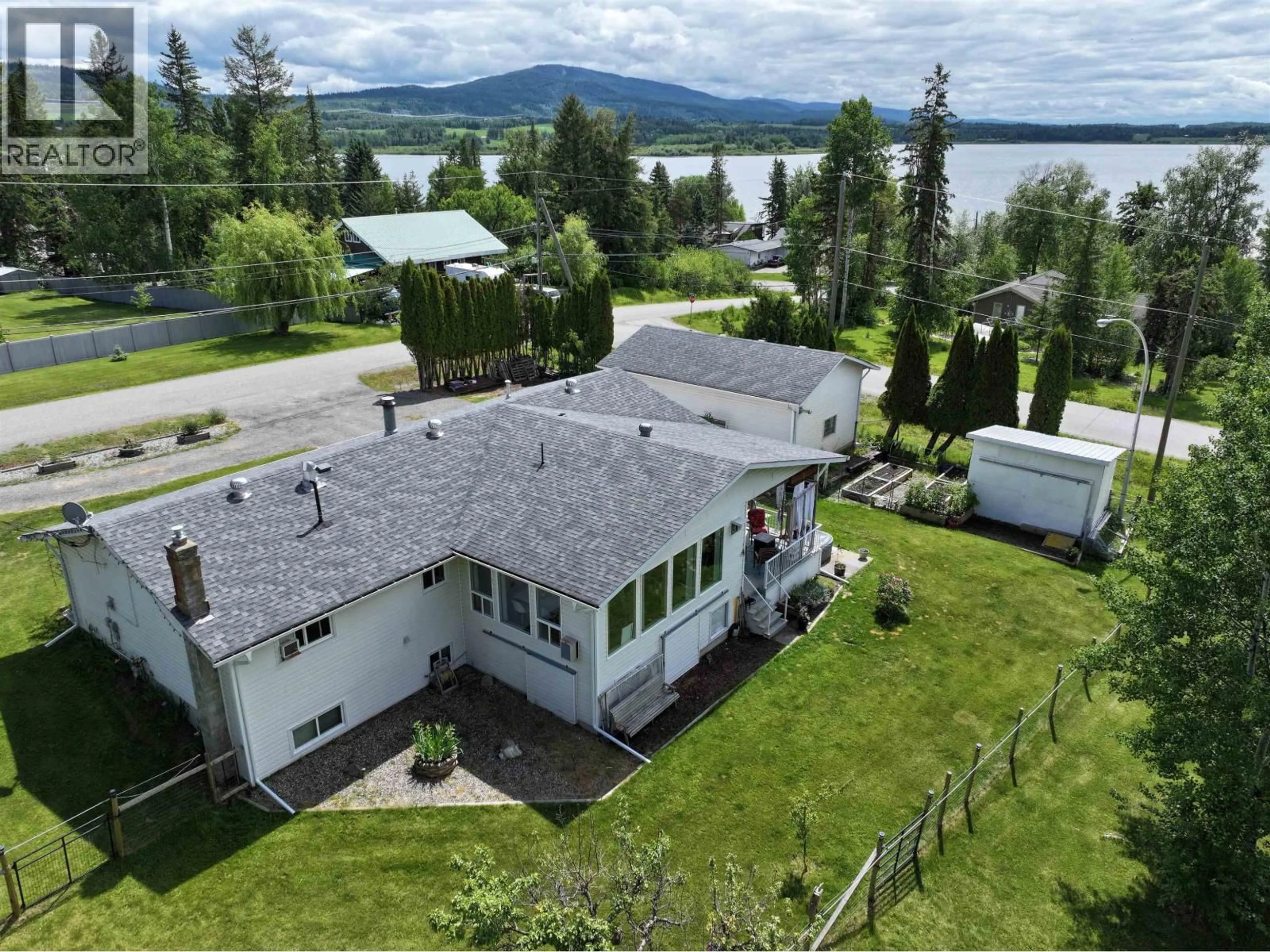 A pic from outside/outdoor area/front of a property/back of a property/a pic from drone, water/lake/river/ocean view for 1541 BEACH CRESCENT, Quesnel British Columbia V2J4J5