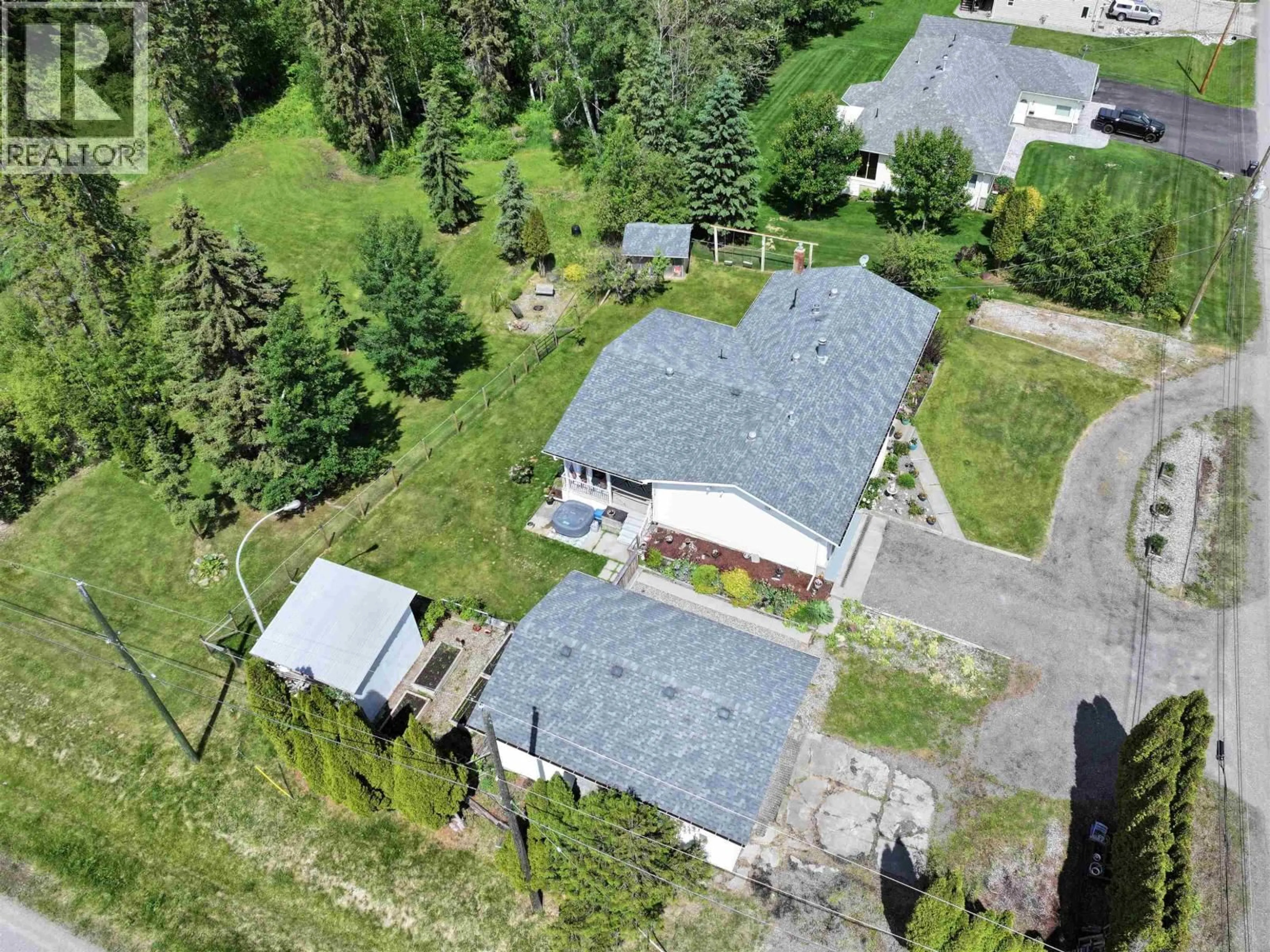 A pic from outside/outdoor area/front of a property/back of a property/a pic from drone, street for 1541 BEACH CRESCENT, Quesnel British Columbia V2J4J5