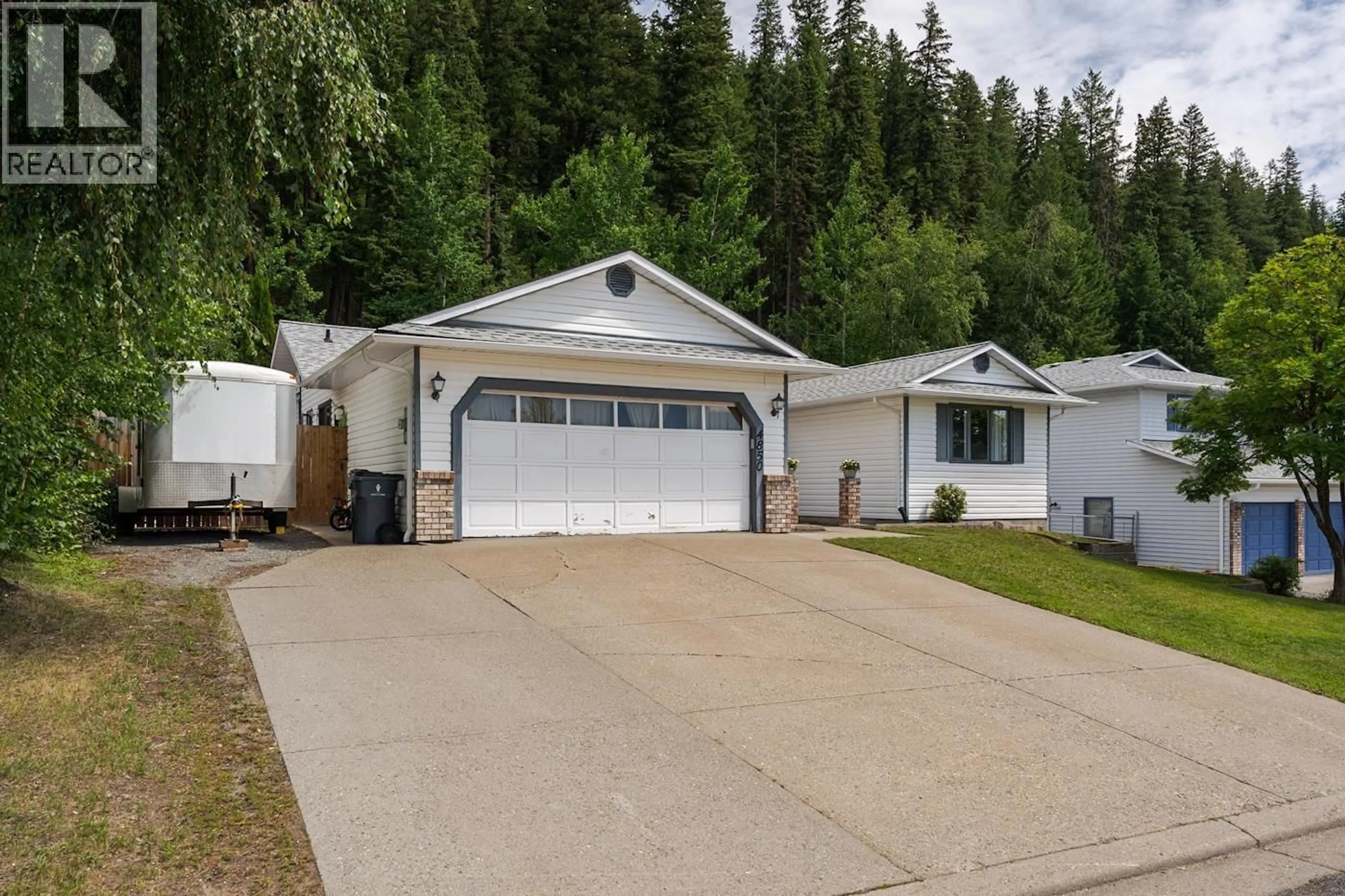 Home with vinyl exterior material, street for 4850 NORTH MEADOW ROAD, Prince George British Columbia V2K4E6