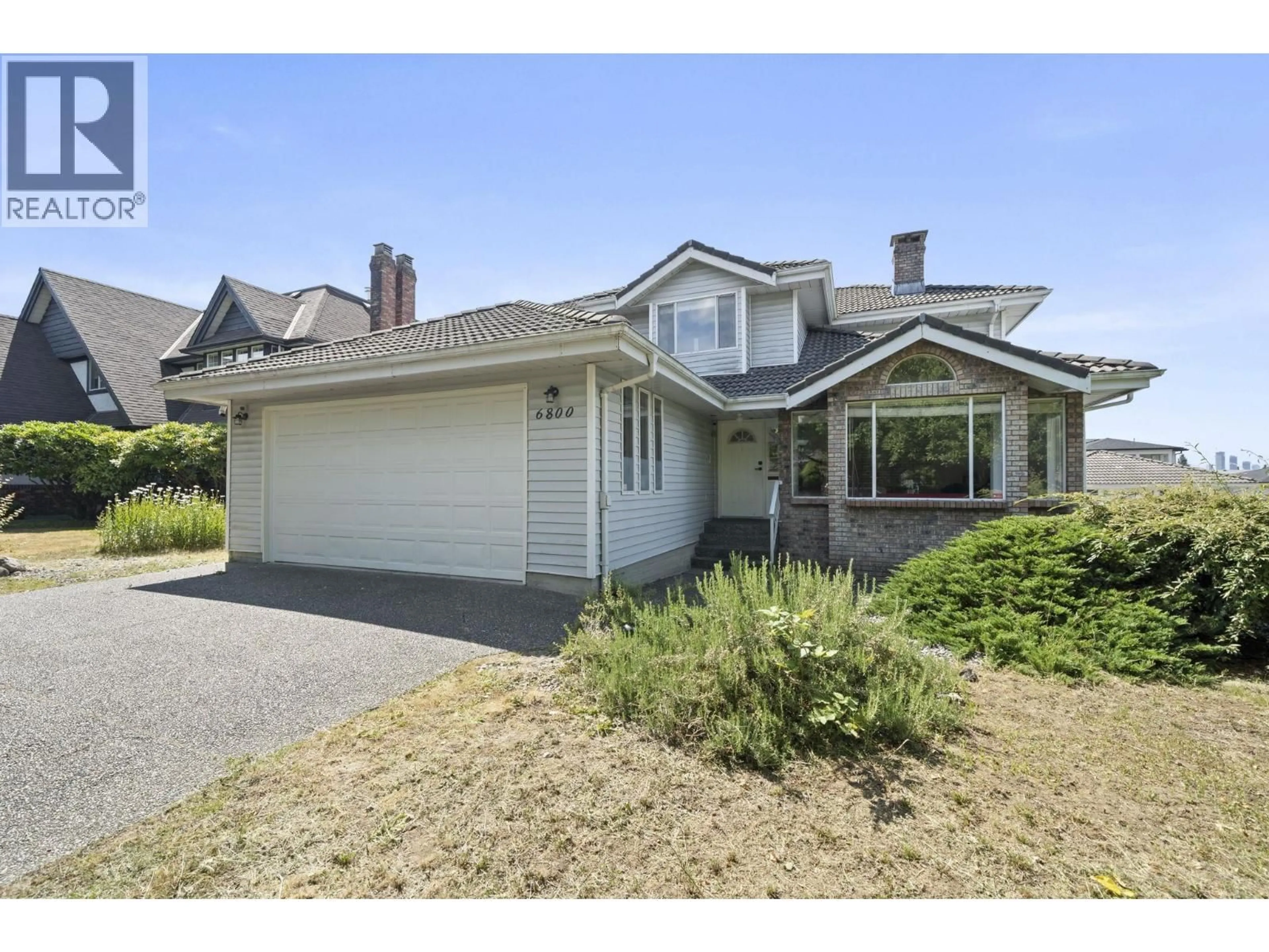 Home with vinyl exterior material, street for 6800 GRANT PLACE, Burnaby British Columbia V5B4X2