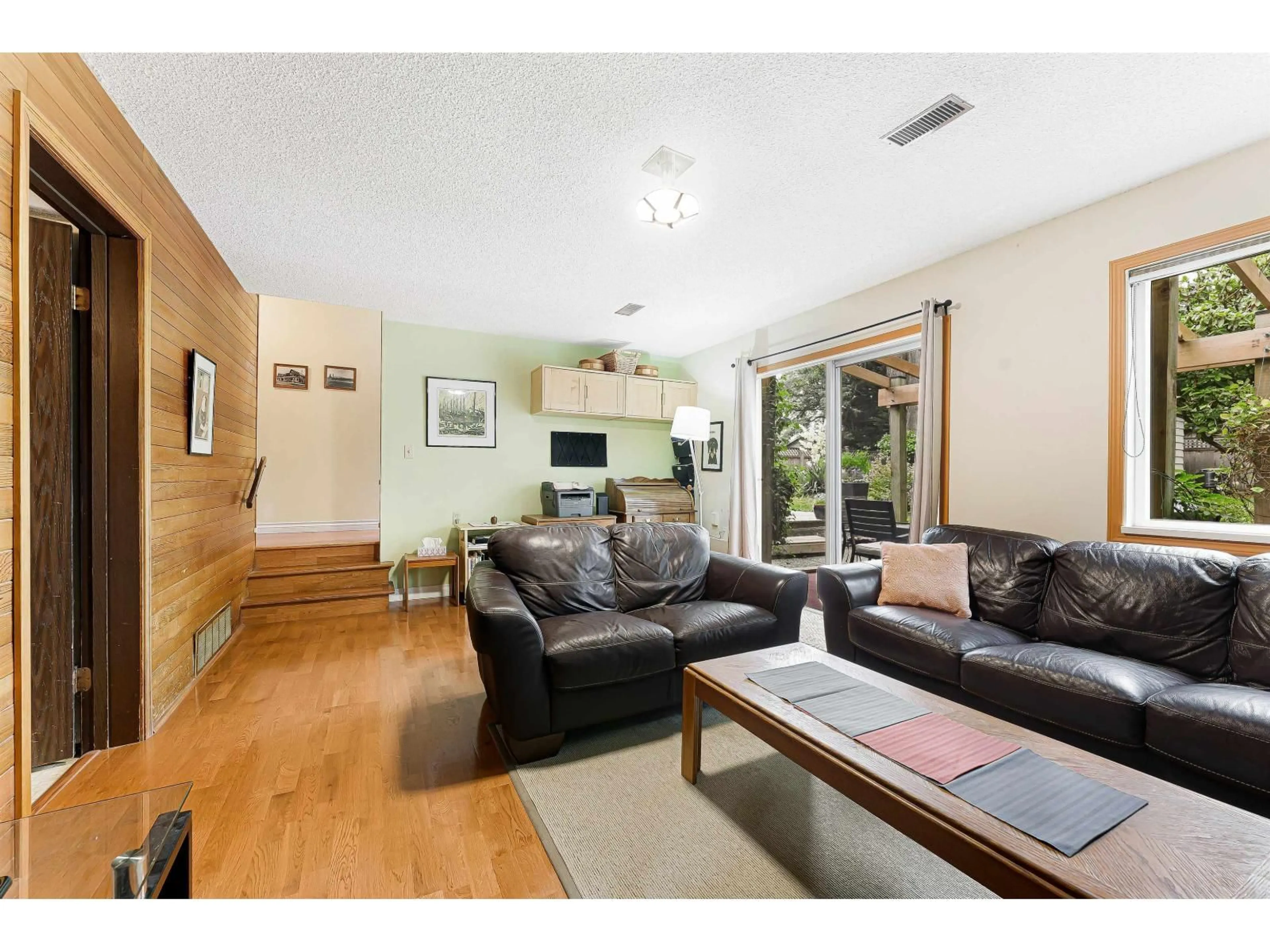 Living room with furniture, wood/laminate floor for 2215 153A STREET, Surrey British Columbia V4A4R4