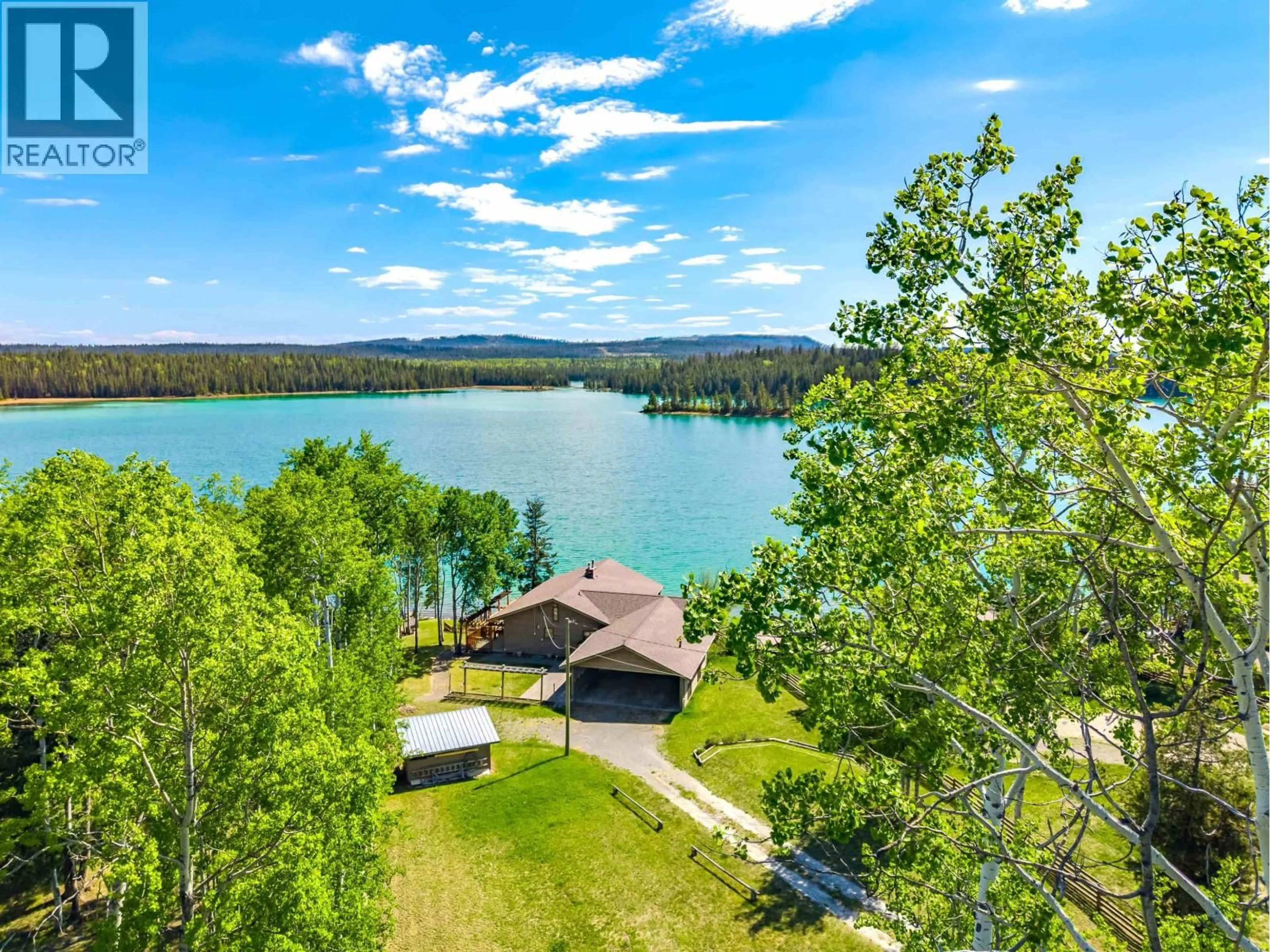A pic from outside/outdoor area/front of a property/back of a property/a pic from drone, water/lake/river/ocean view for 6410 FOX CRESCENT, Green Lake British Columbia V0K2K1