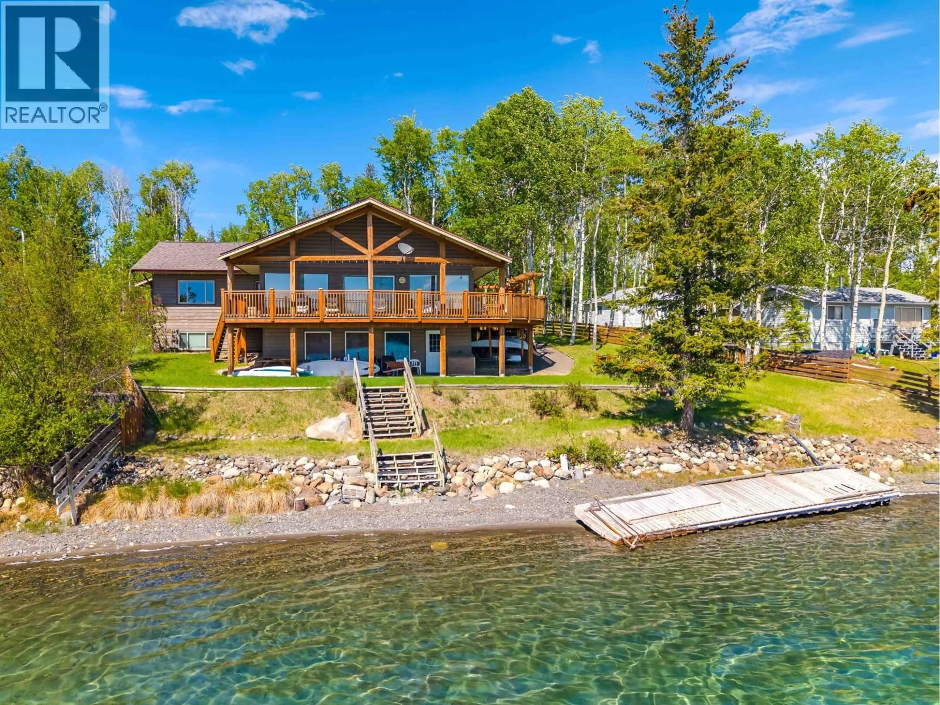 A pic from outside/outdoor area/front of a property/back of a property/a pic from drone, water/lake/river/ocean view for 6410 FOX CRESCENT, Green Lake British Columbia V0K2K0