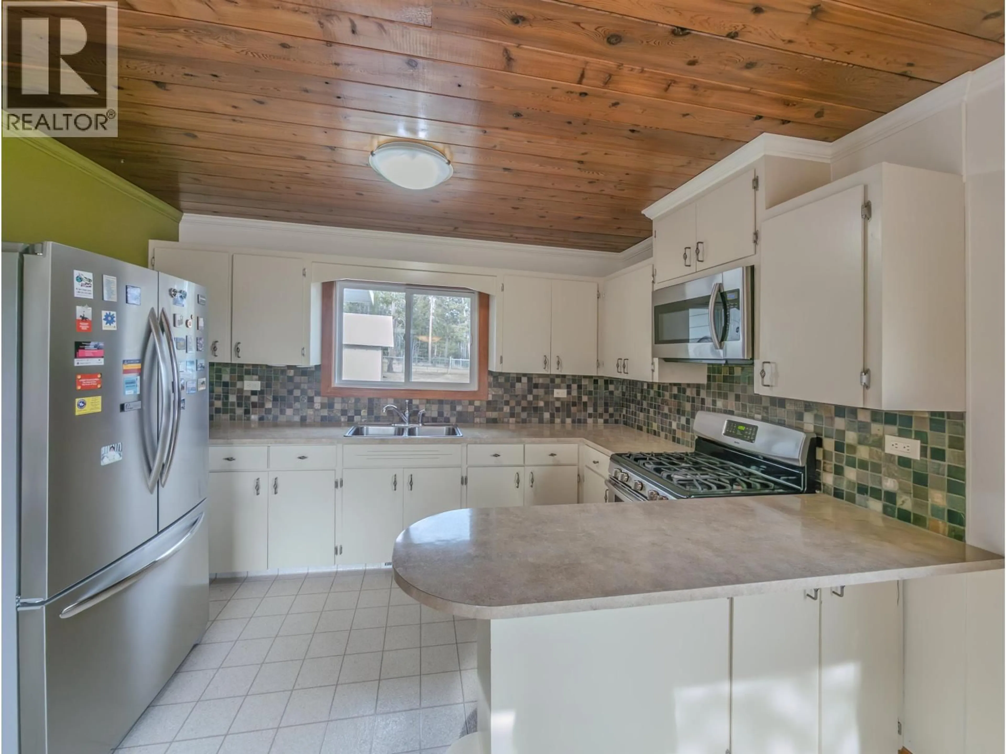 Open concept kitchen, ceramic/tile floor for 4734 KITWANGA DRIVE, 108 Mile Ranch British Columbia V0K2Z0