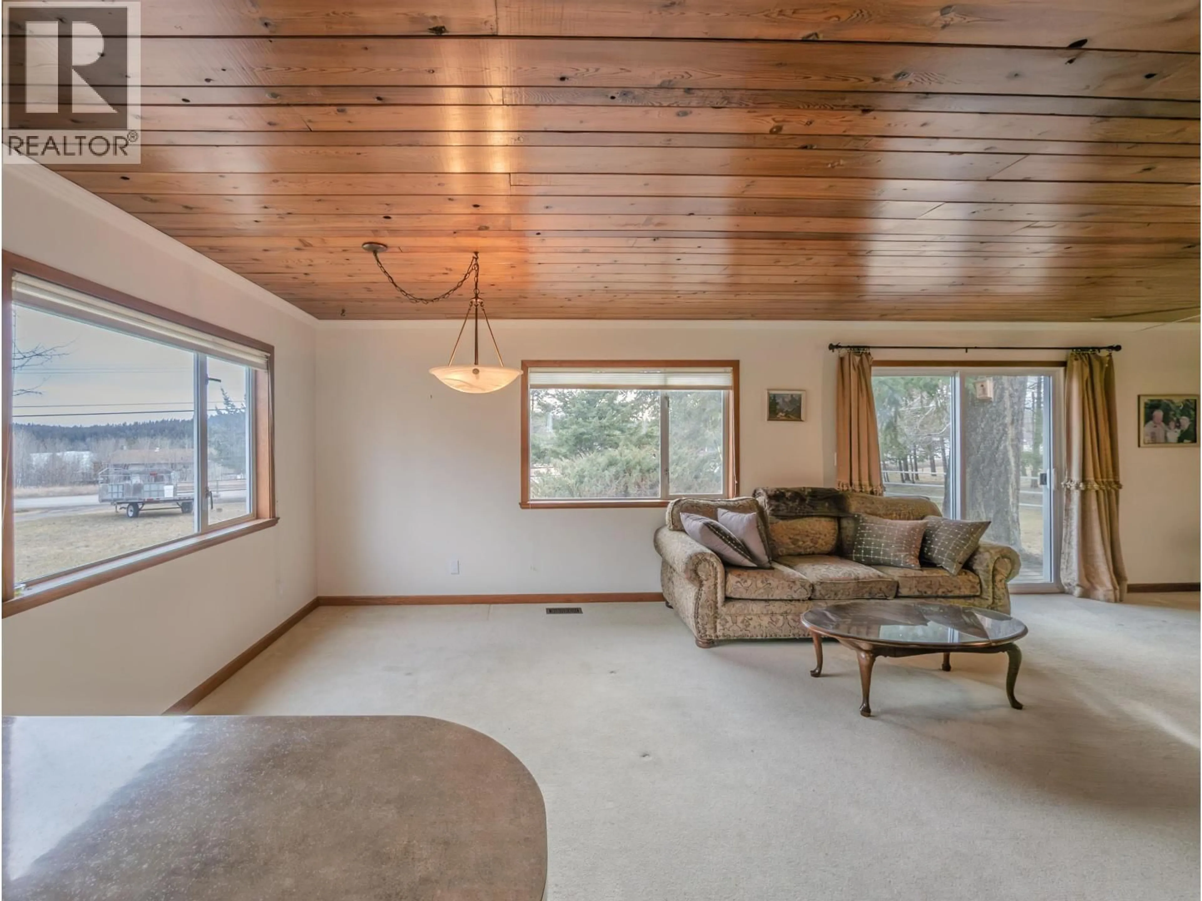Living room with furniture, unknown for 4734 KITWANGA DRIVE, 108 Mile Ranch British Columbia V0K2Z0