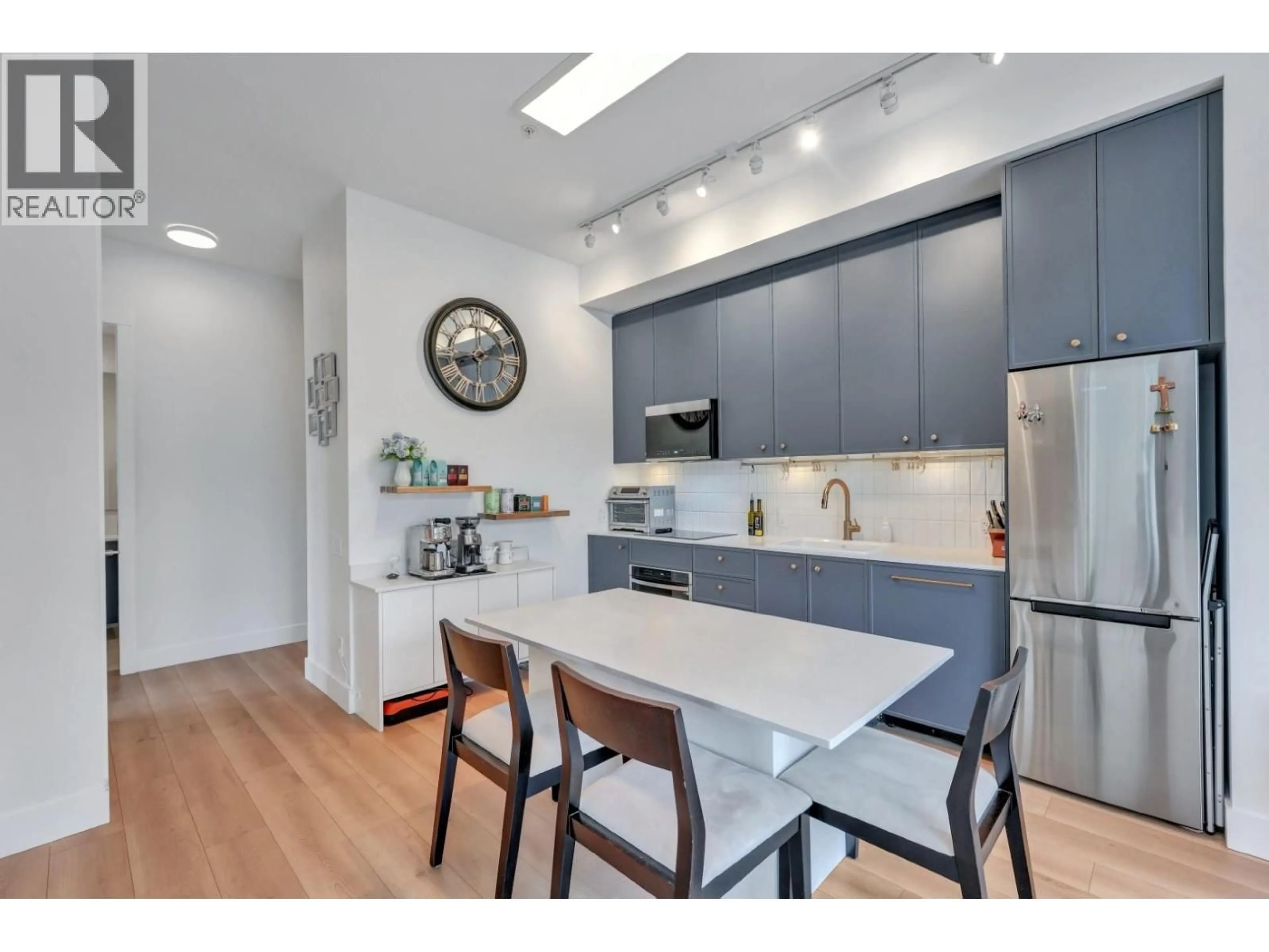 Open concept kitchen, wood/laminate floor for 404 - 718 EDGAR AVENUE, Coquitlam British Columbia V3K0H2