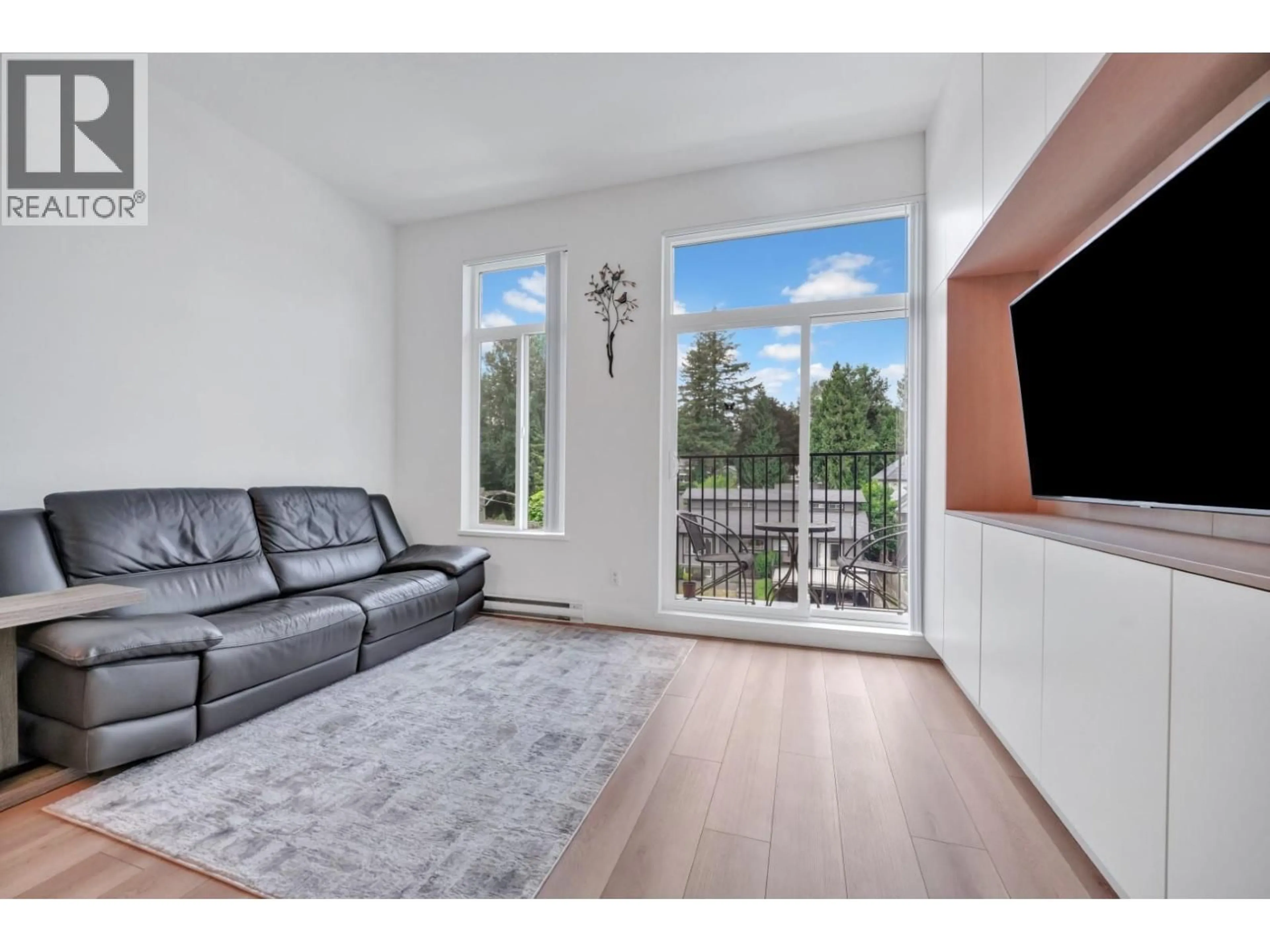 Living room with furniture, wood/laminate floor for 404 - 718 EDGAR AVENUE, Coquitlam British Columbia V3K0H2
