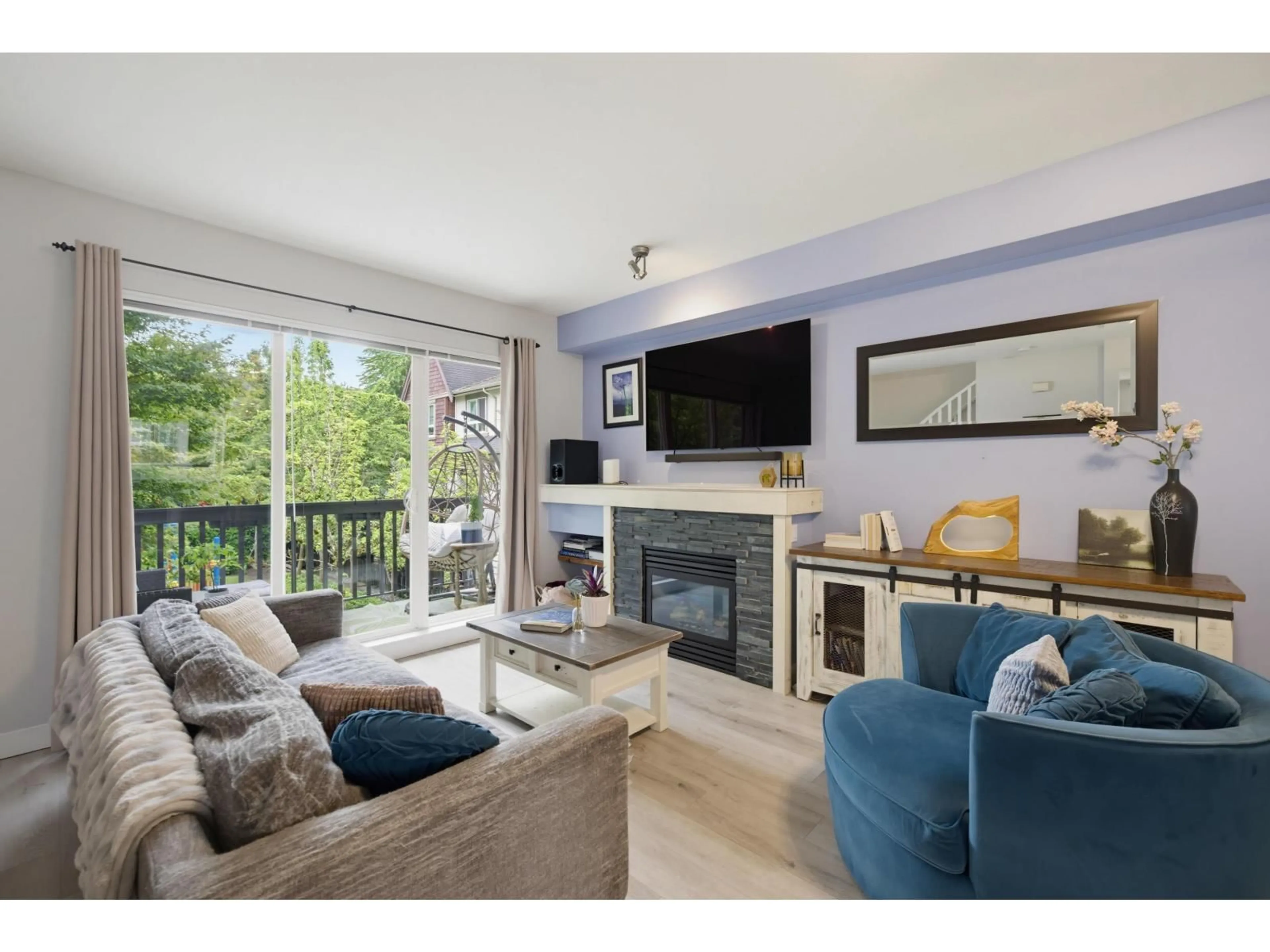 Living room with furniture, wood/laminate floor for 46 - 7155 189 STREET, Surrey British Columbia V4N5S8