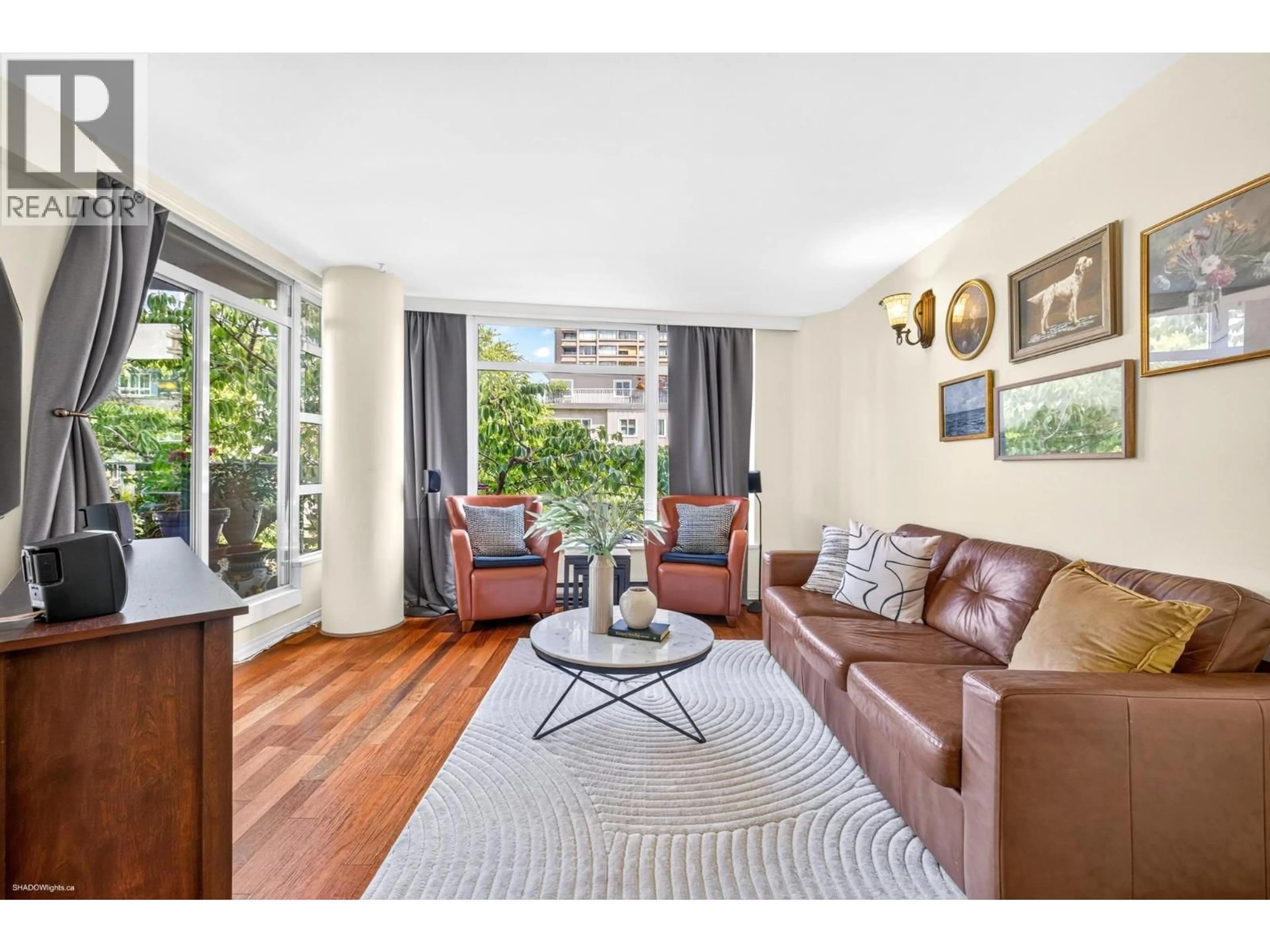 Living room with furniture, wood/laminate floor for 201 - 1272 COMOX STREET, Vancouver British Columbia V6E1K7