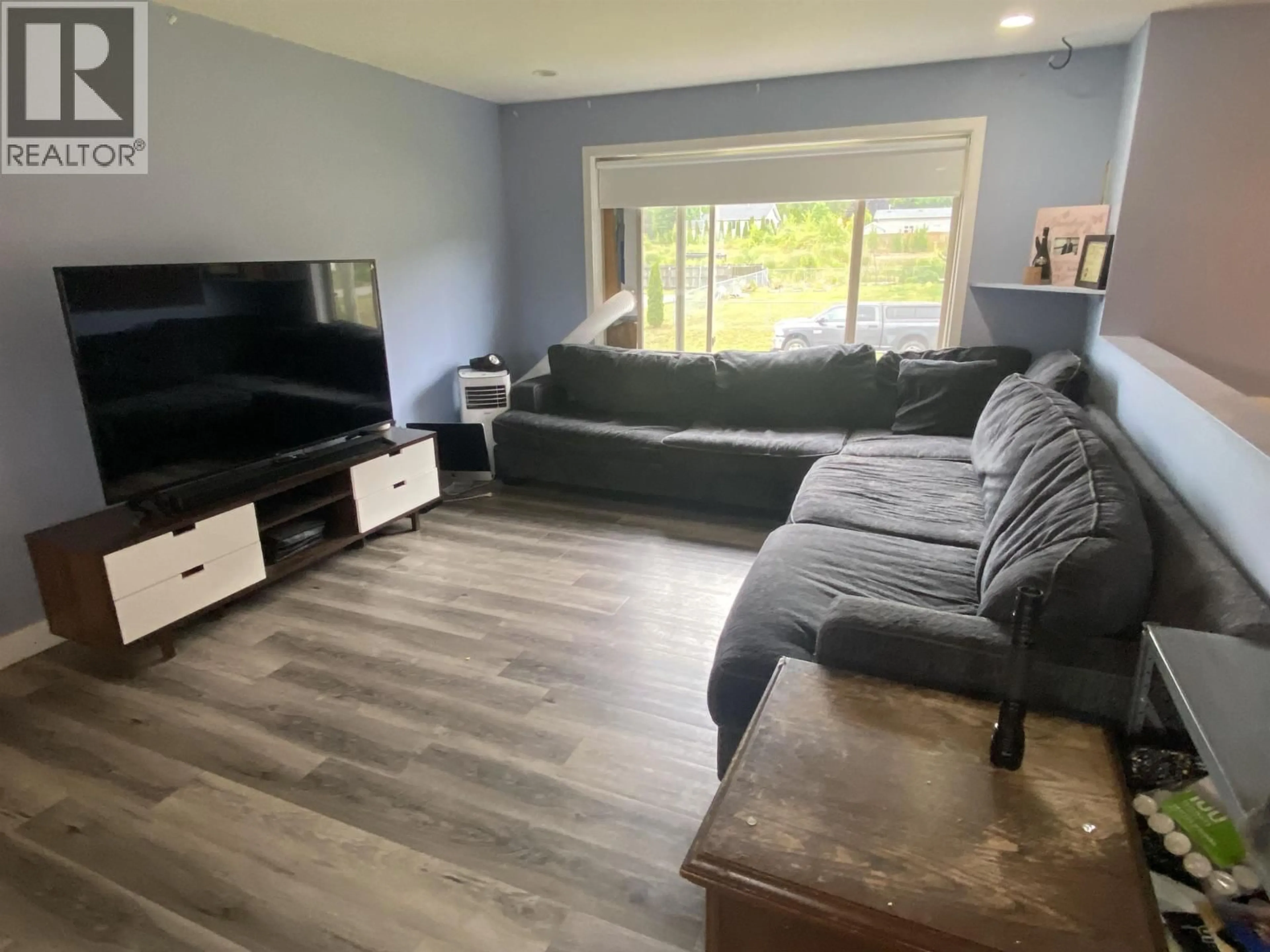 Living room with furniture, wood/laminate floor for 3775 DOBBIE STREET, Terrace British Columbia V8G5T7