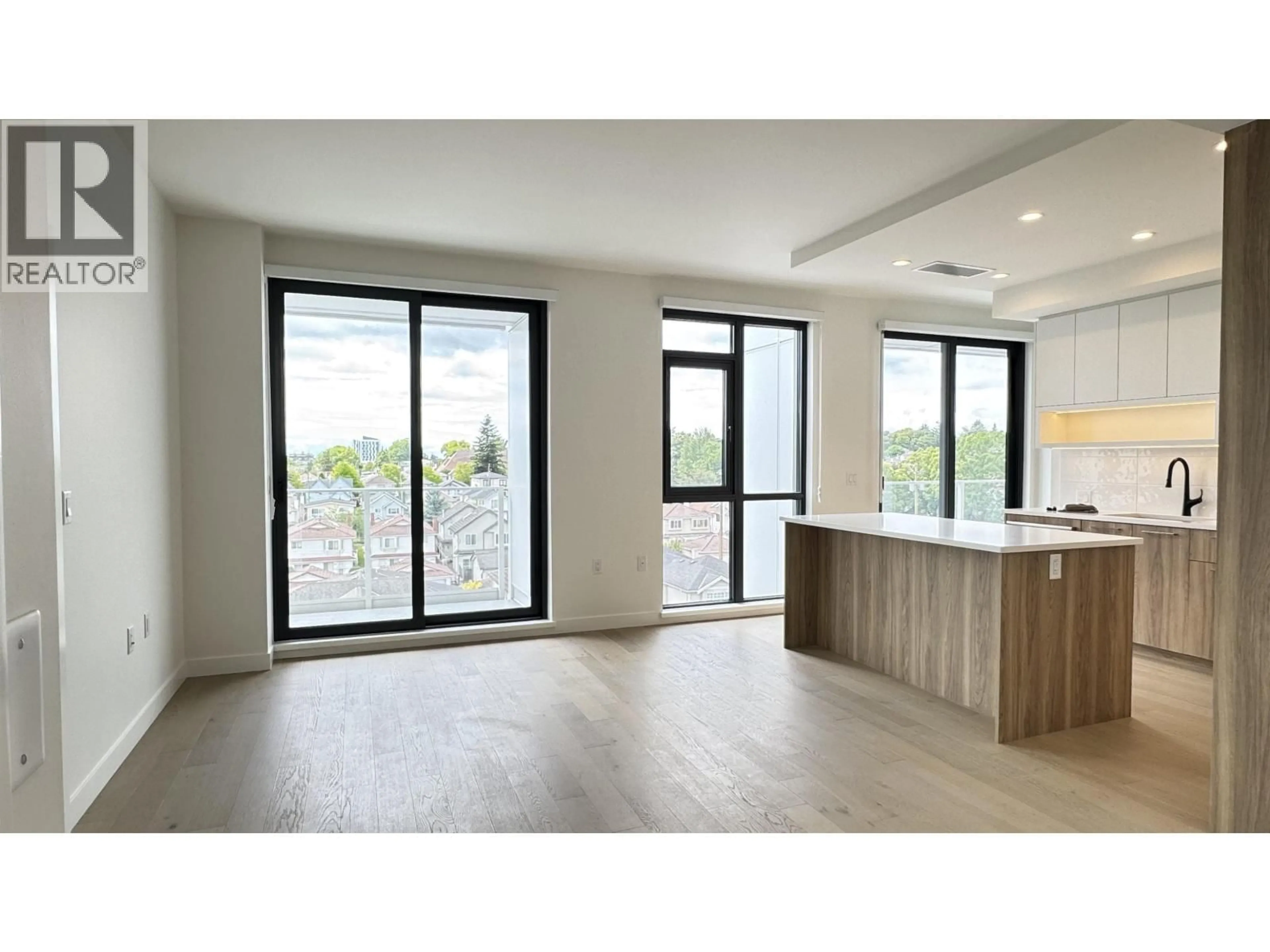Open concept kitchen, wood/laminate floor for 604 - 8398 OAK STREET, Vancouver British Columbia V6P0L9