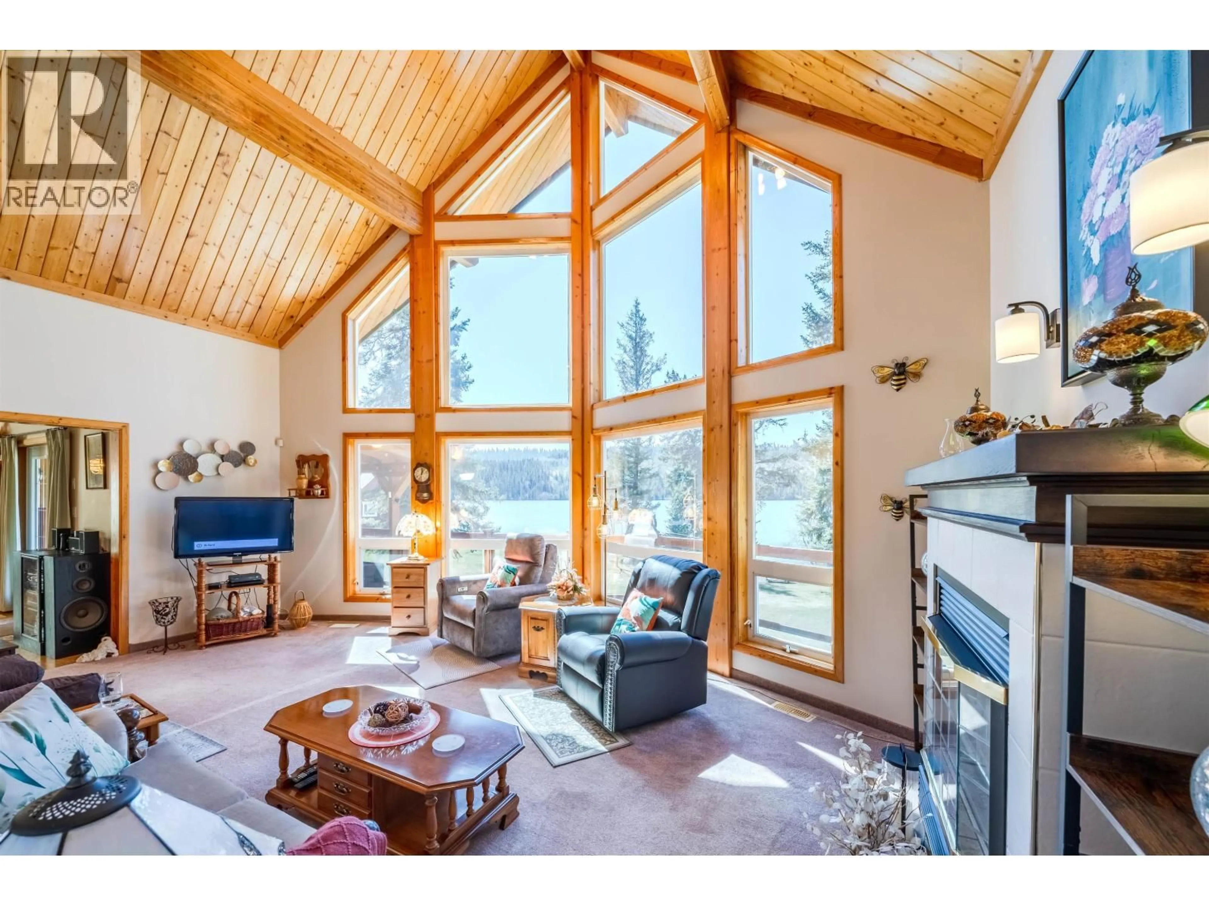 Living room with furniture, wood/laminate floor for 3544 CABIN ROAD, Lac La Hache British Columbia V0K1T1
