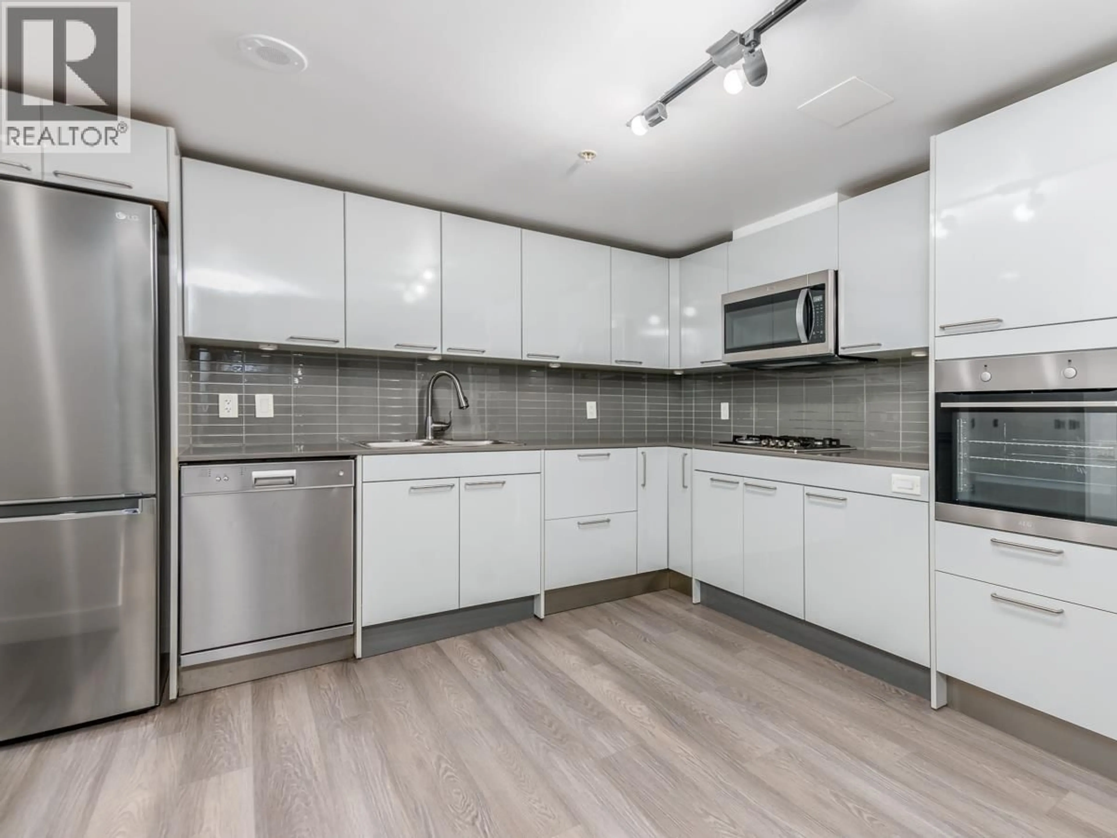 Open concept kitchen, unknown for 202 - 128 CORDOVA STREET, Vancouver British Columbia V6B0E6