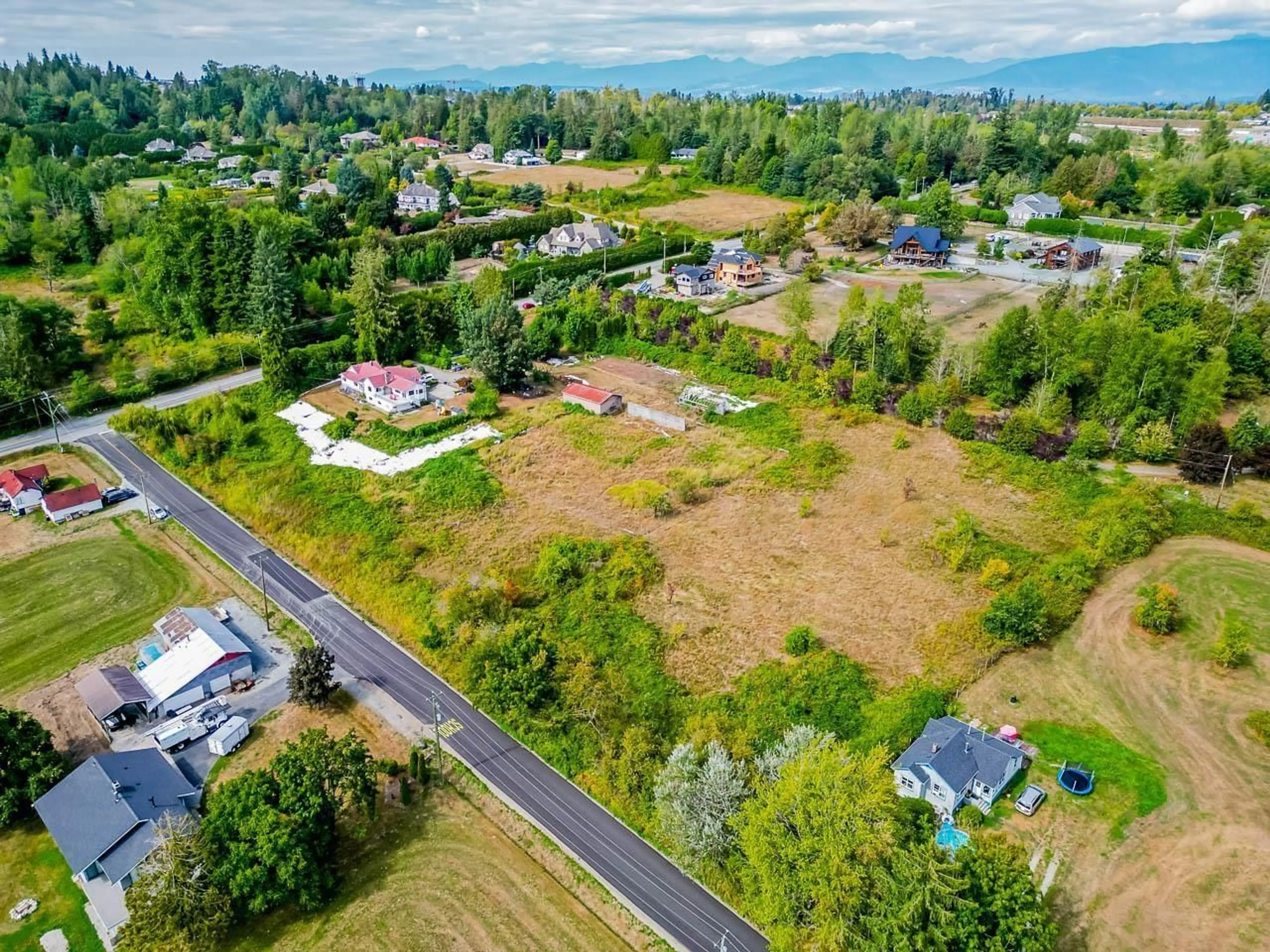 A pic from outside/outdoor area/front of a property/back of a property/a pic from drone, street for 7714 216 STREET, Langley British Columbia V2Y2S5