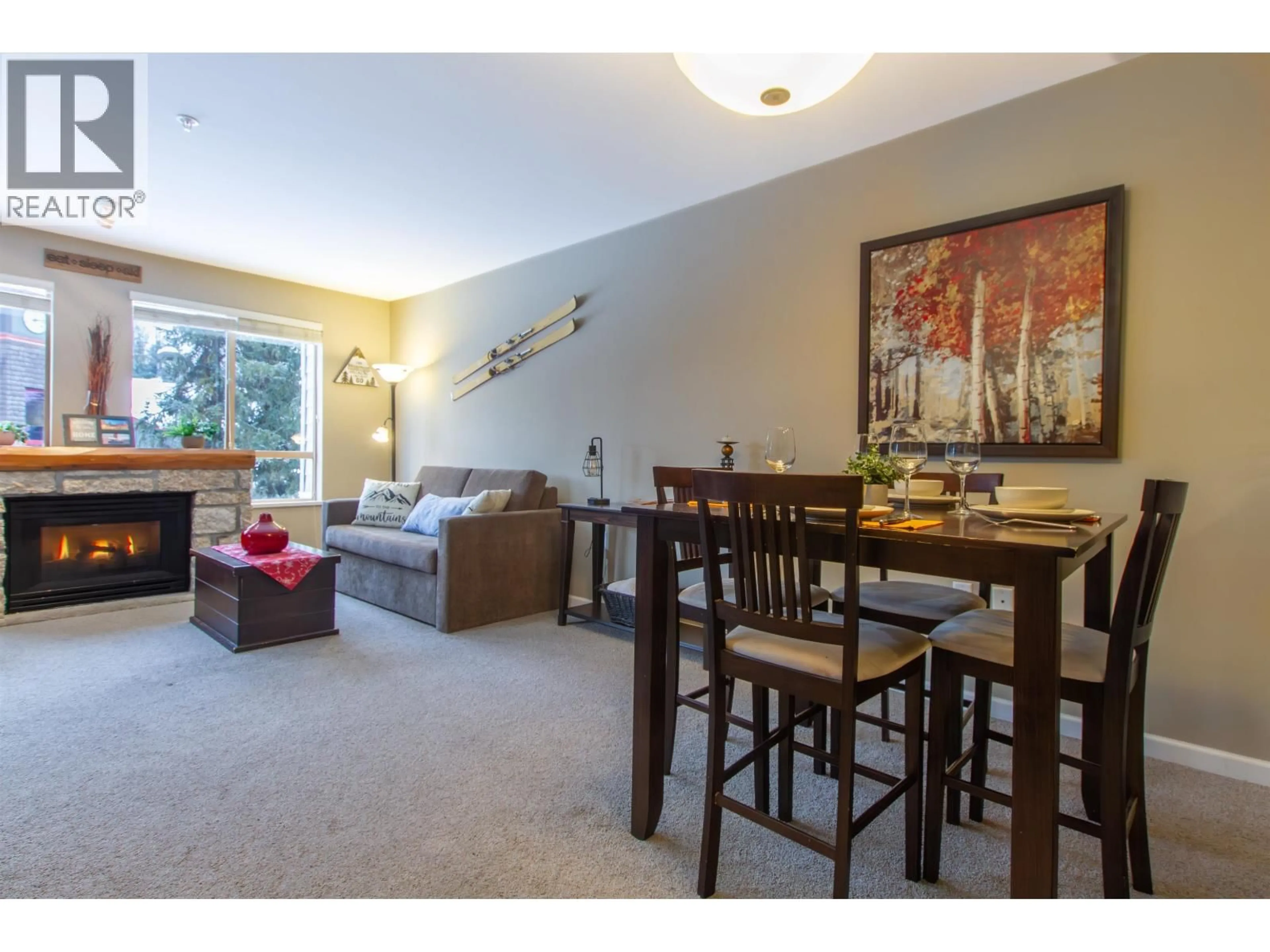 Living room with furniture, wood/laminate floor for 216 - 4338 MAIN STREET, Whistler British Columbia V8E1B4