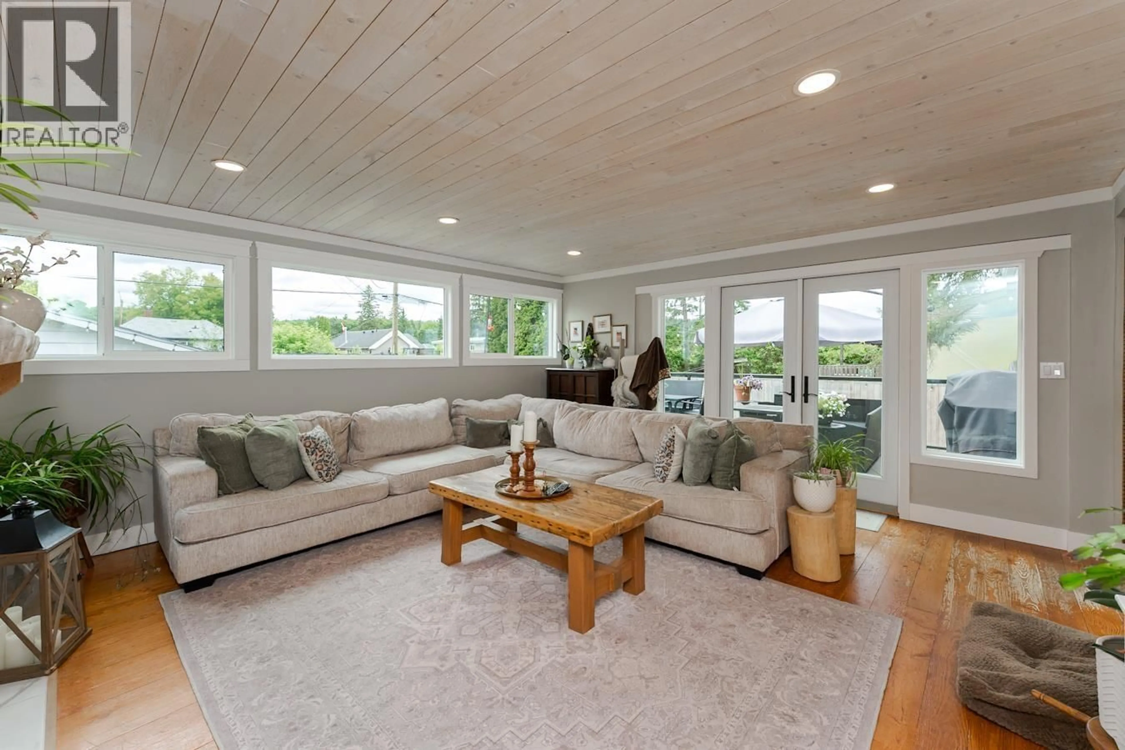 Living room with furniture, wood/laminate floor for 1576 HEMLOCK STREET, Prince George British Columbia V2L1H9