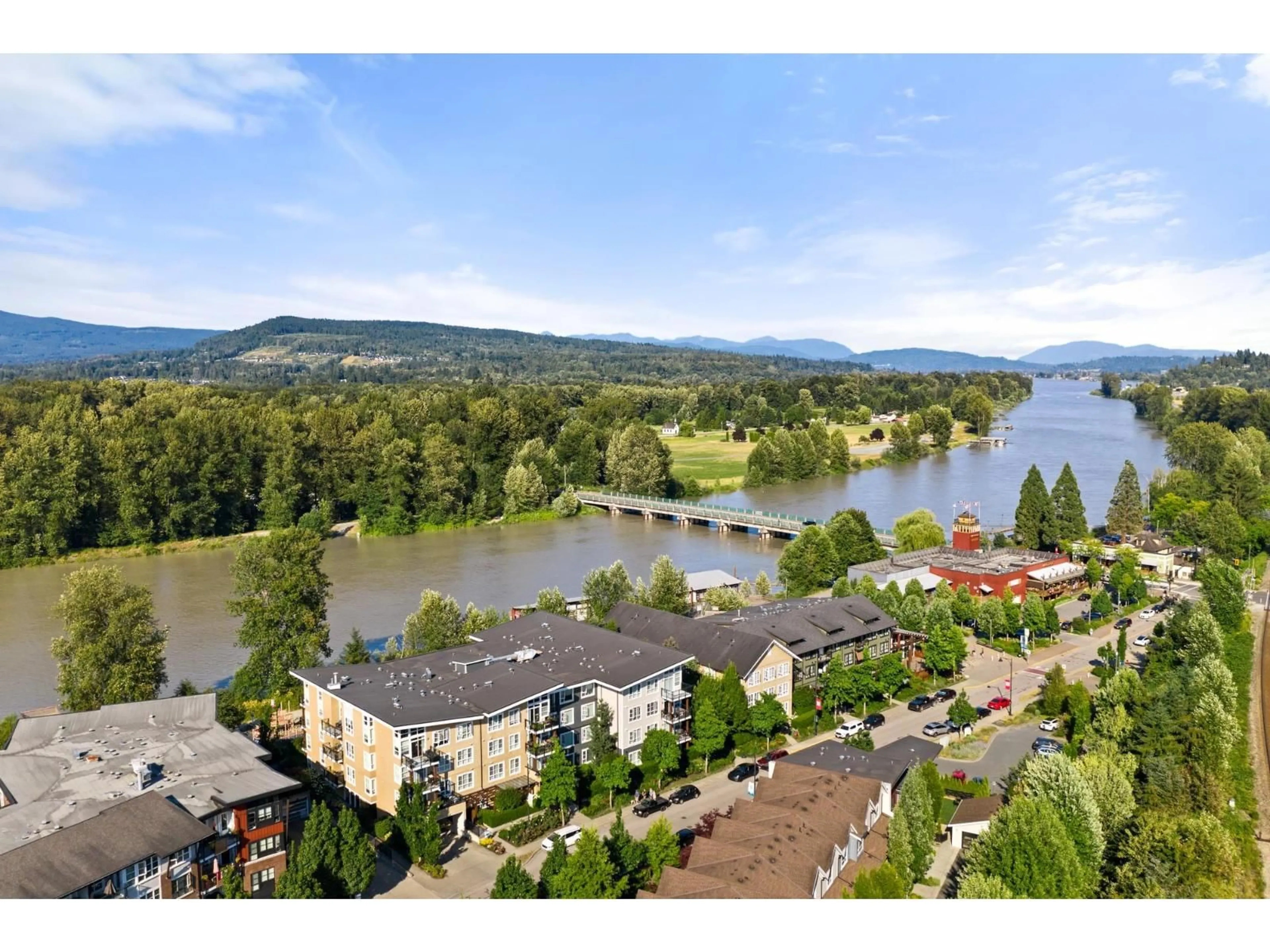 A pic from outside/outdoor area/front of a property/back of a property/a pic from drone, water/lake/river/ocean view for 207 - 23255 BILLY BROWN ROAD, Langley British Columbia V1M0C8