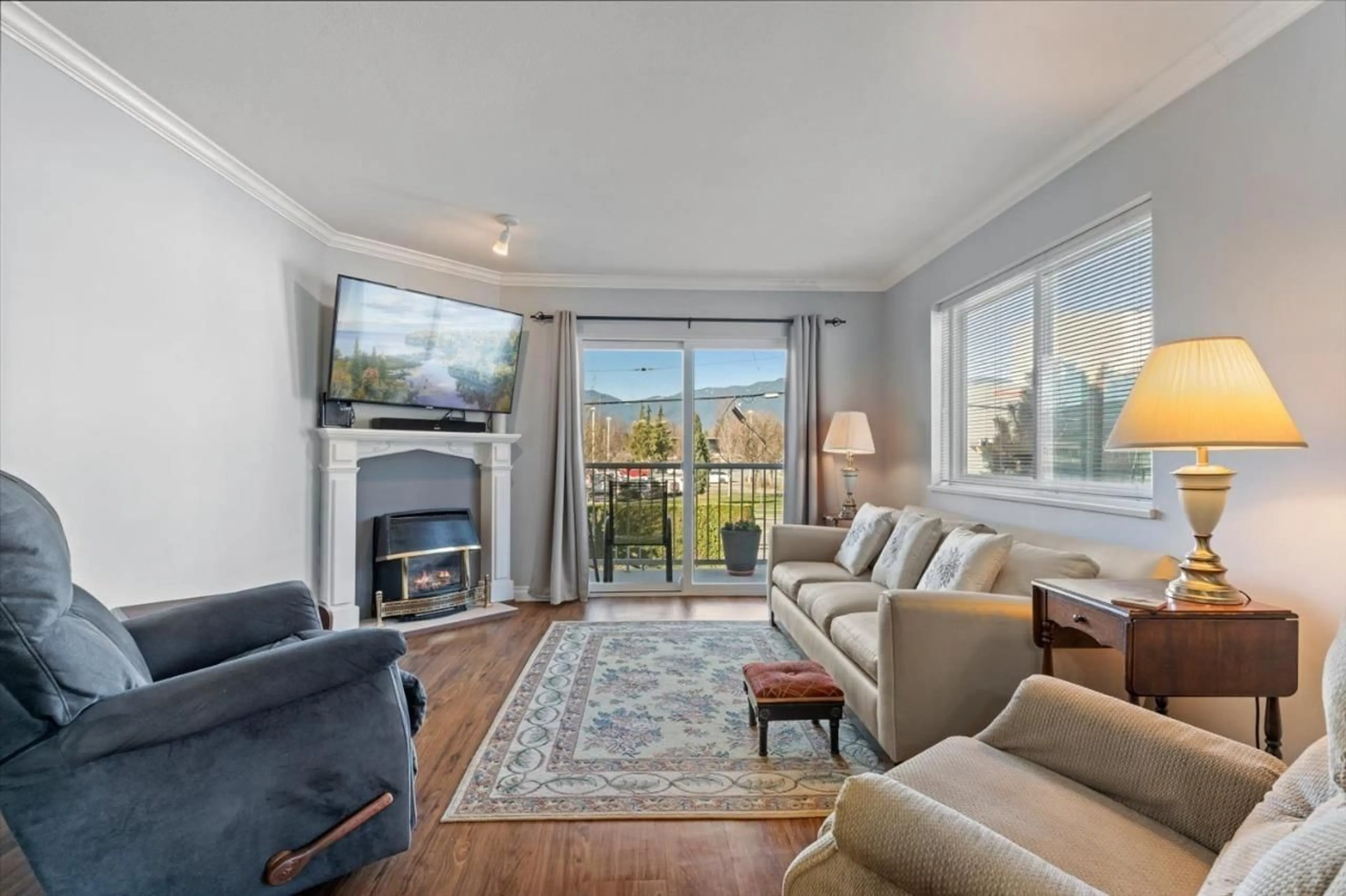 Living room with furniture, wood/laminate floor for 204 - 9175 EDWARD STREET, Chilliwack British Columbia V2P4C5