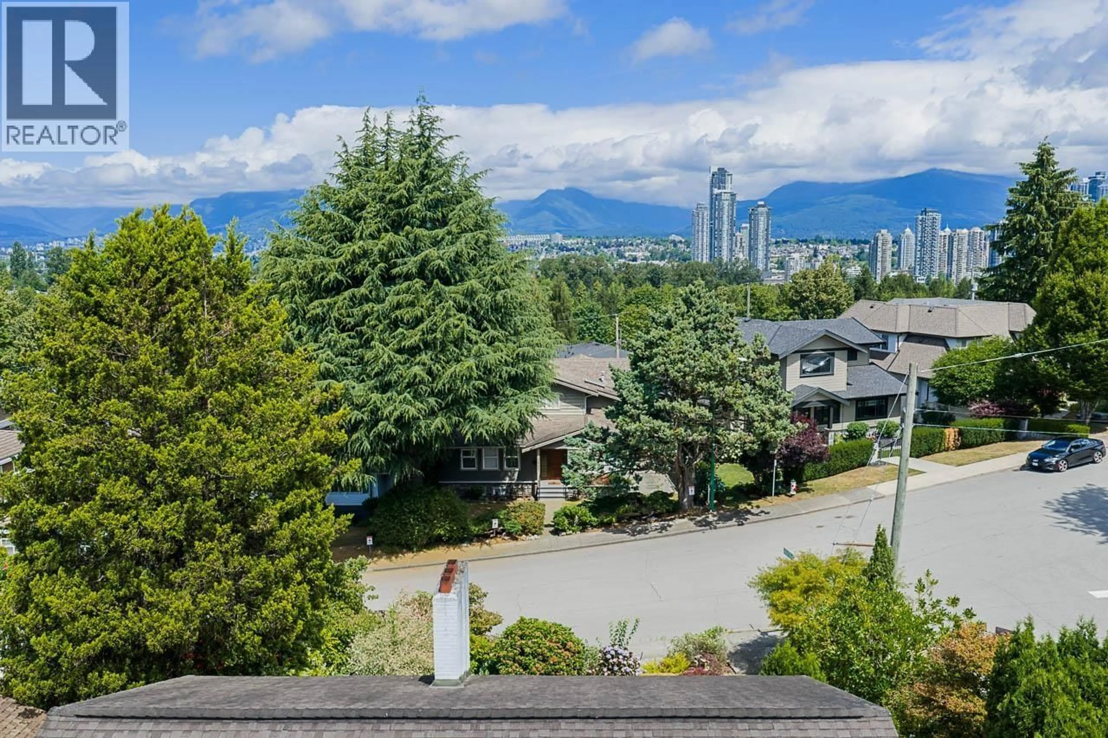 A pic from outside/outdoor area/front of a property/back of a property/a pic from drone, mountain view for 3896 ELMWOOD STREET, Burnaby British Columbia V5G1S1