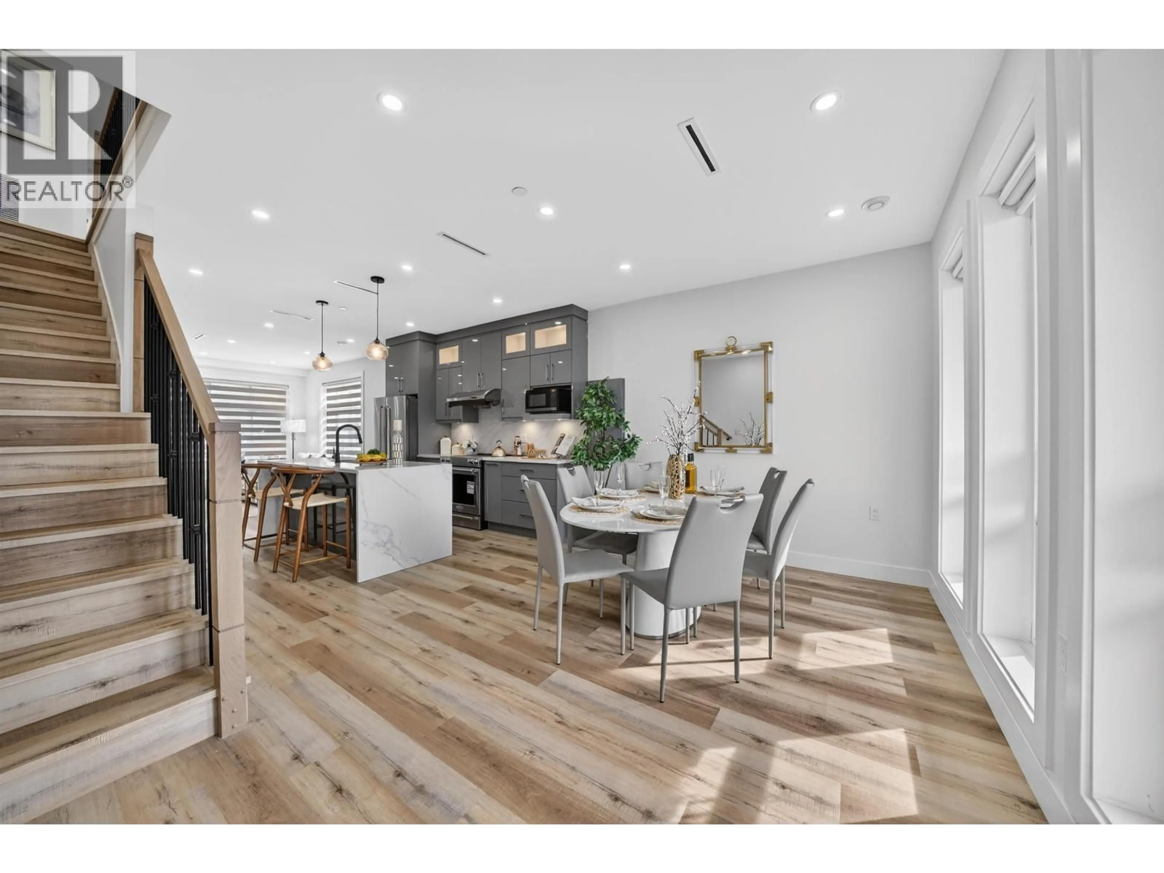 Open concept kitchen, wood/laminate floor for 516 60TH AVENUE, Vancouver British Columbia V6P1Z7