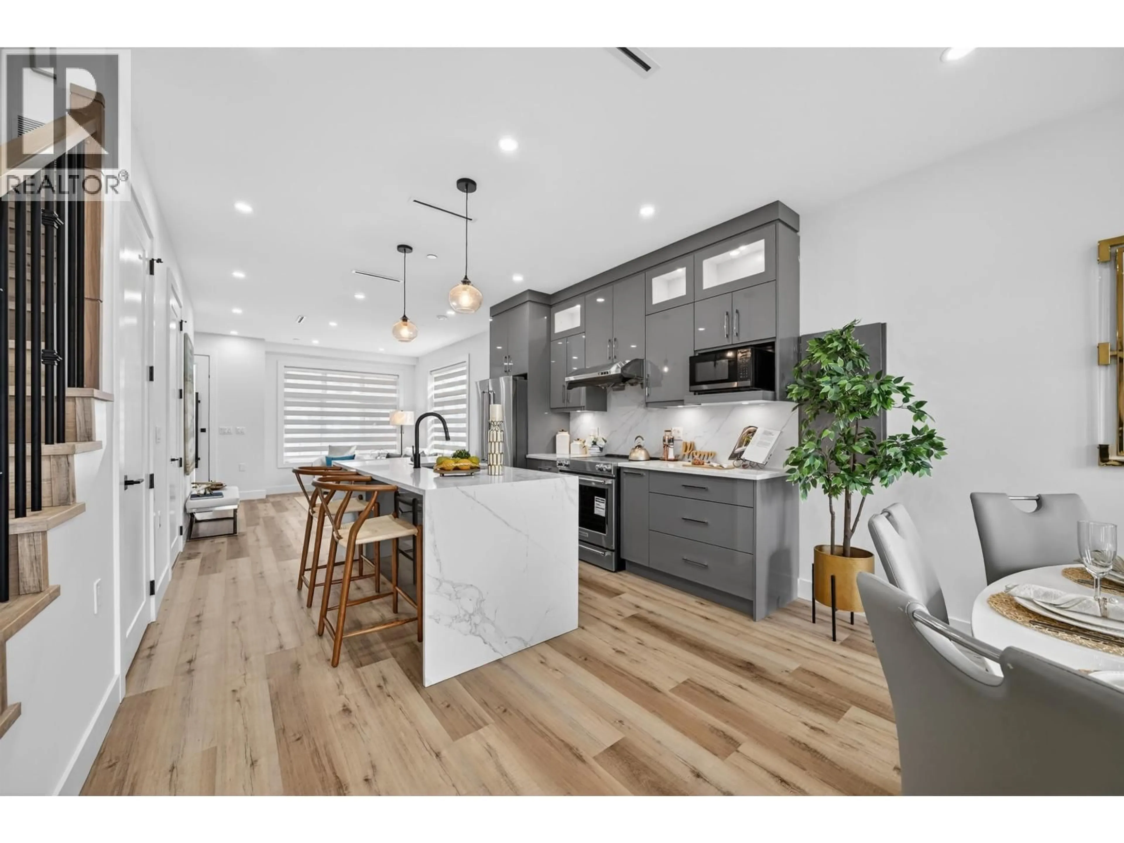 Open concept kitchen, wood/laminate floor for 516 60TH AVENUE, Vancouver British Columbia V6P1Z7