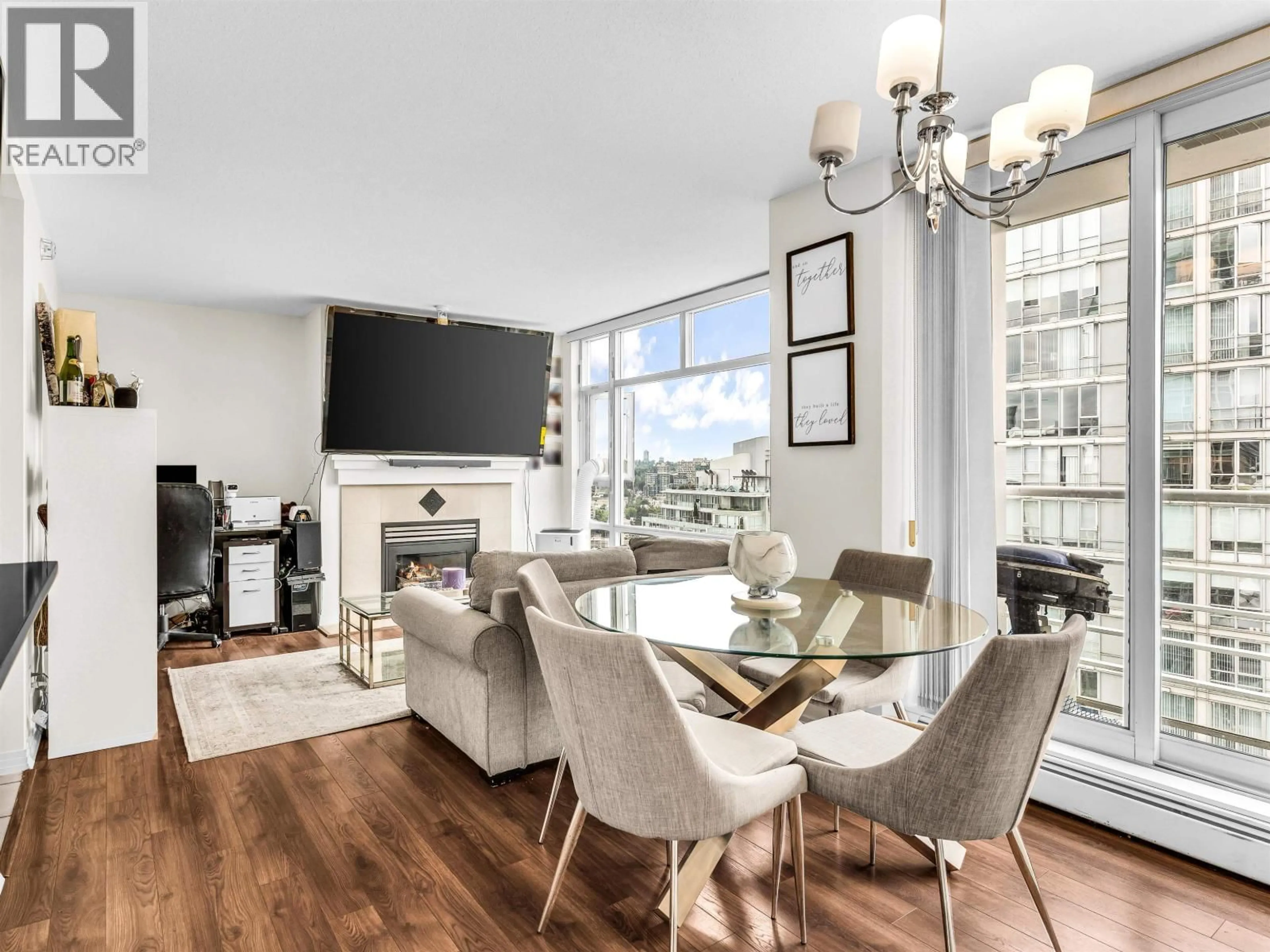 Living room with furniture, wood/laminate floor for 2807 - 1199 MARINASIDE CRESCENT, Vancouver British Columbia V6Z2Y2