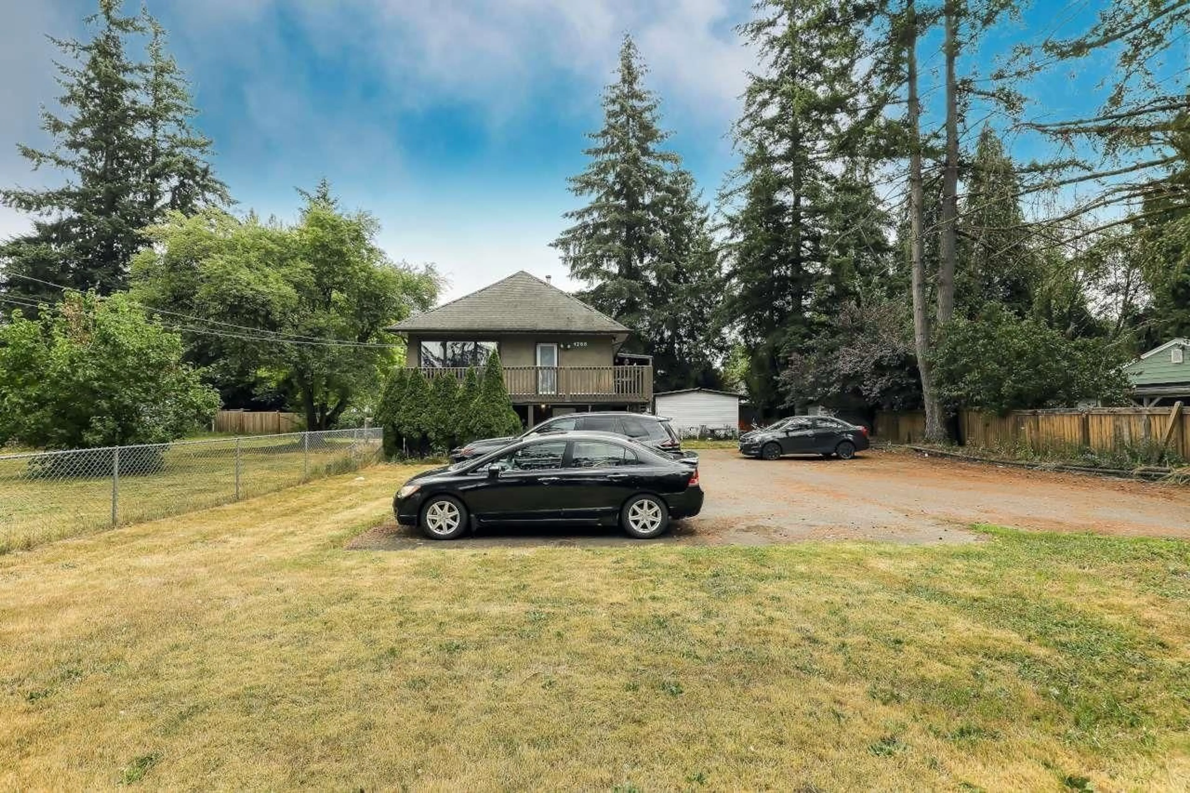 A pic from outside/outdoor area/front of a property/back of a property/a pic from drone, street for 4288 200 STREET, Langley British Columbia V3A1L1