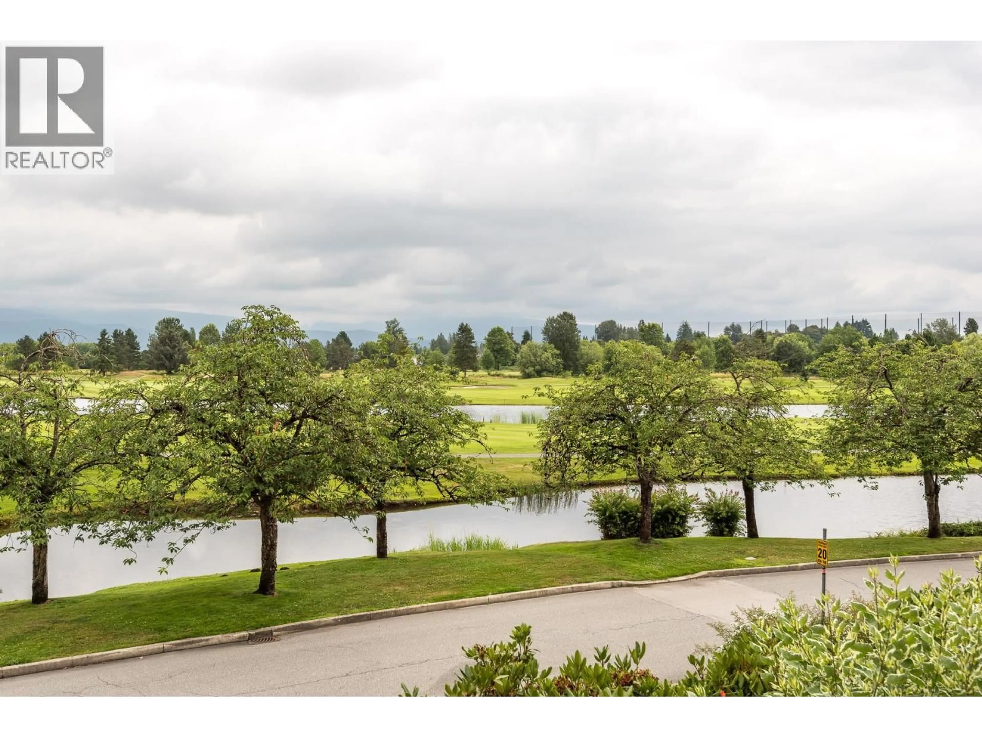 A pic from outside/outdoor area/front of a property/back of a property/a pic from drone, water/lake/river/ocean view for 129 - 19673 MEADOW GARDENS WAY, Pitt Meadows British Columbia V3Y0A1