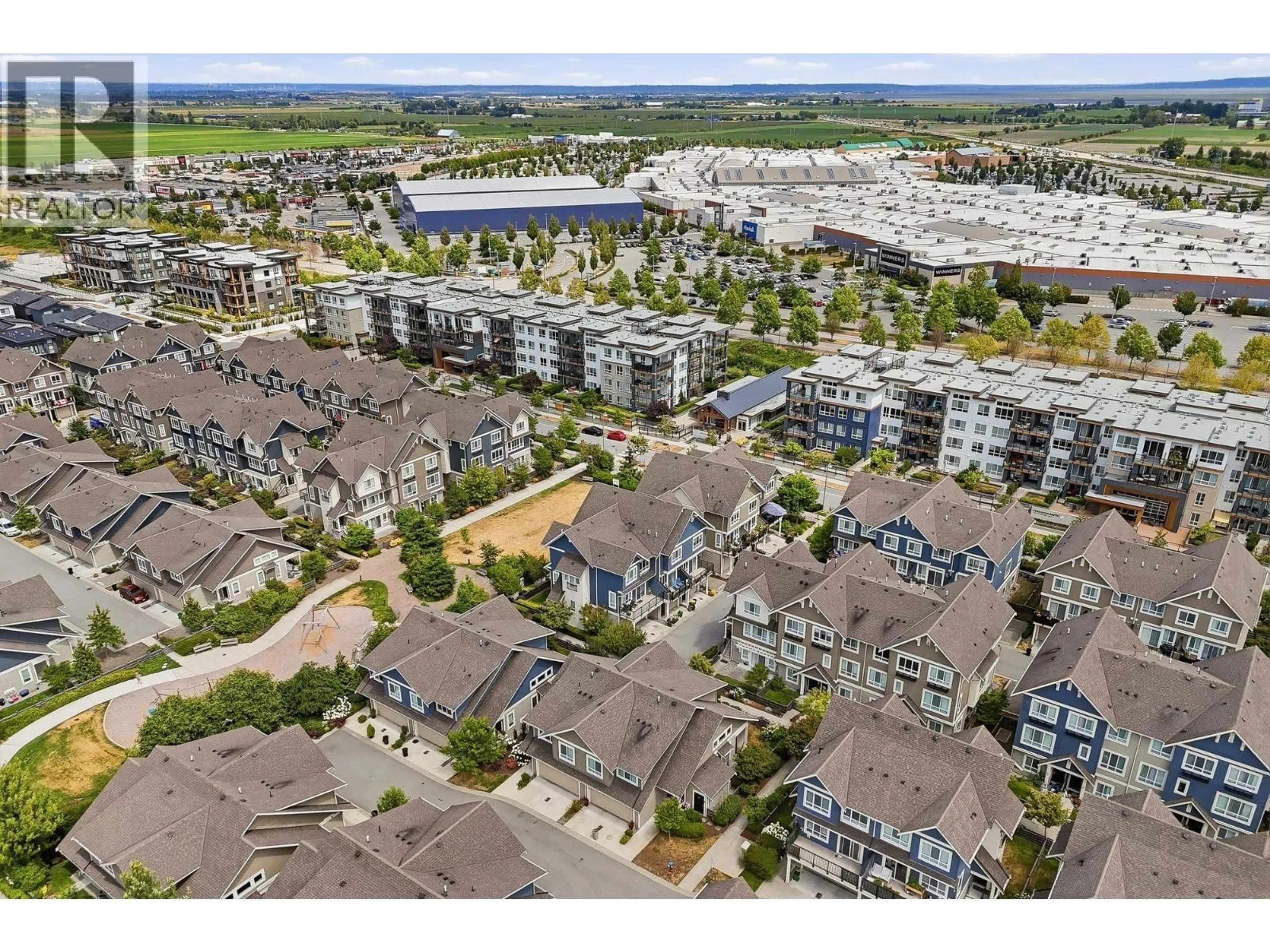 A pic from outside/outdoor area/front of a property/back of a property/a pic from drone, water/lake/river/ocean view for 204 - 1816 OSPREY DRIVE, Delta British Columbia V4M0B8