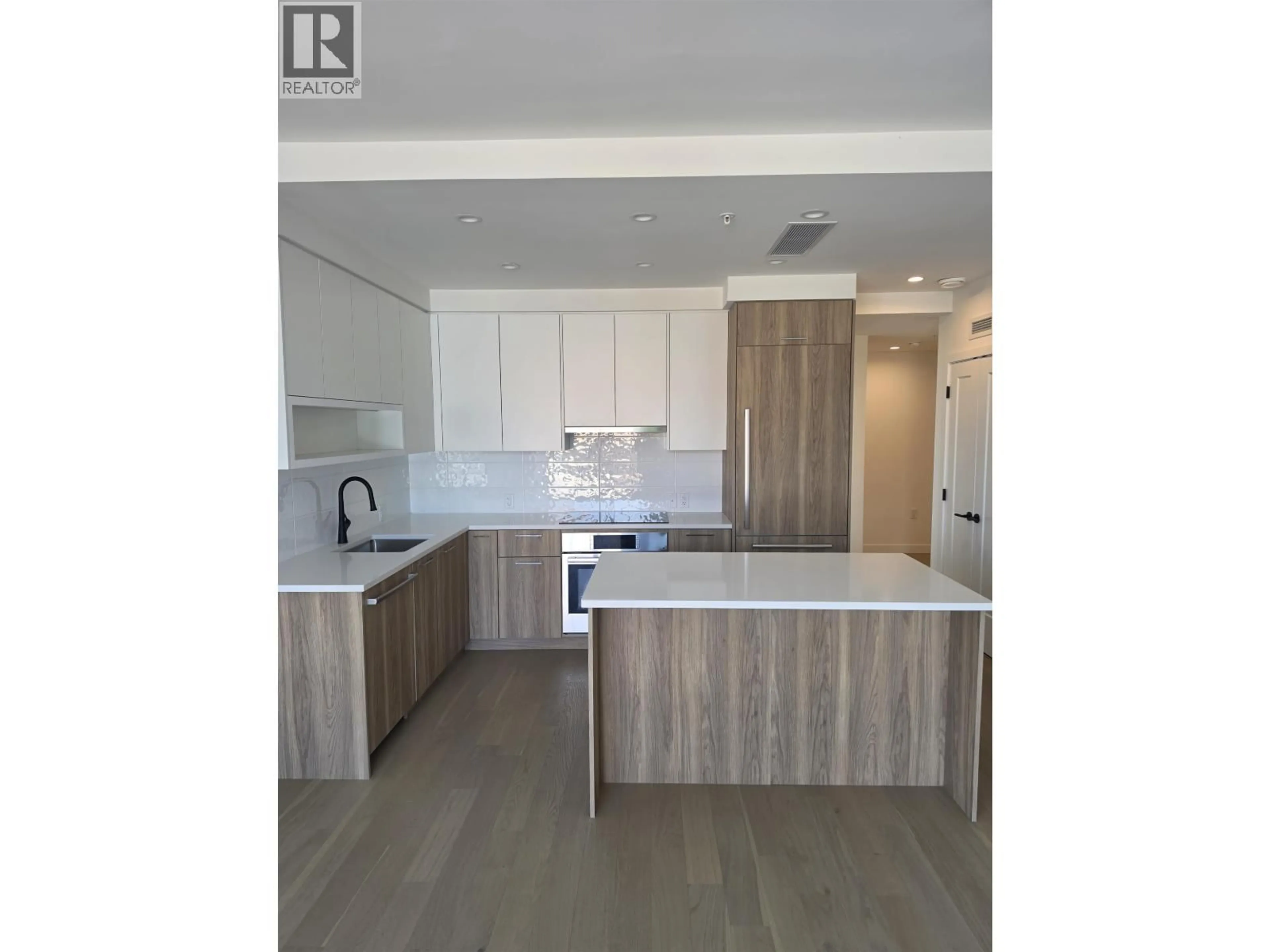 Open concept kitchen, wood/laminate floor for 203 - 8398 OAK STREET, Vancouver British Columbia V6P0L9