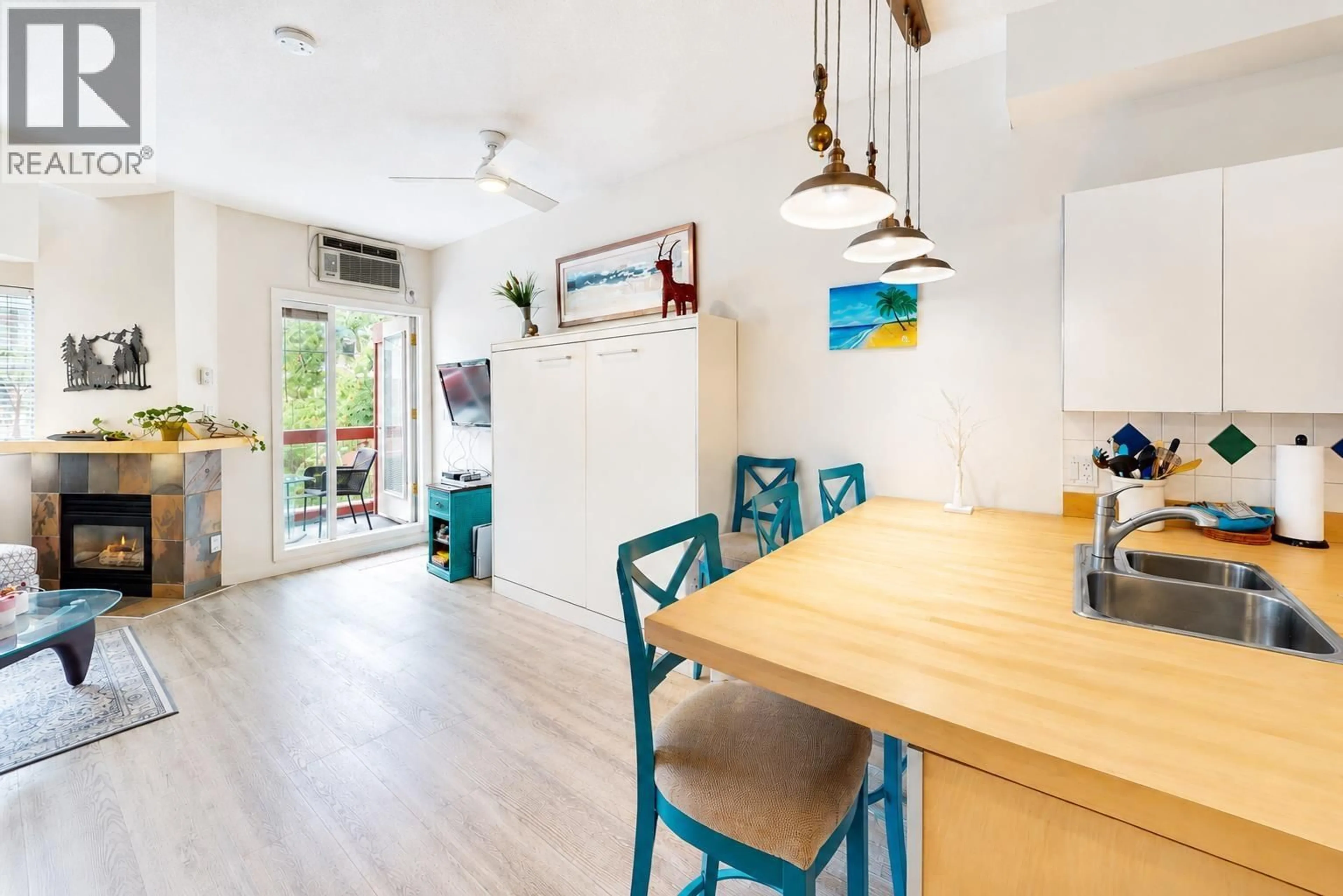 Open concept kitchen, wood/laminate floor for 303 - 4368 MAIN STREET, Whistler British Columbia V8E1B6