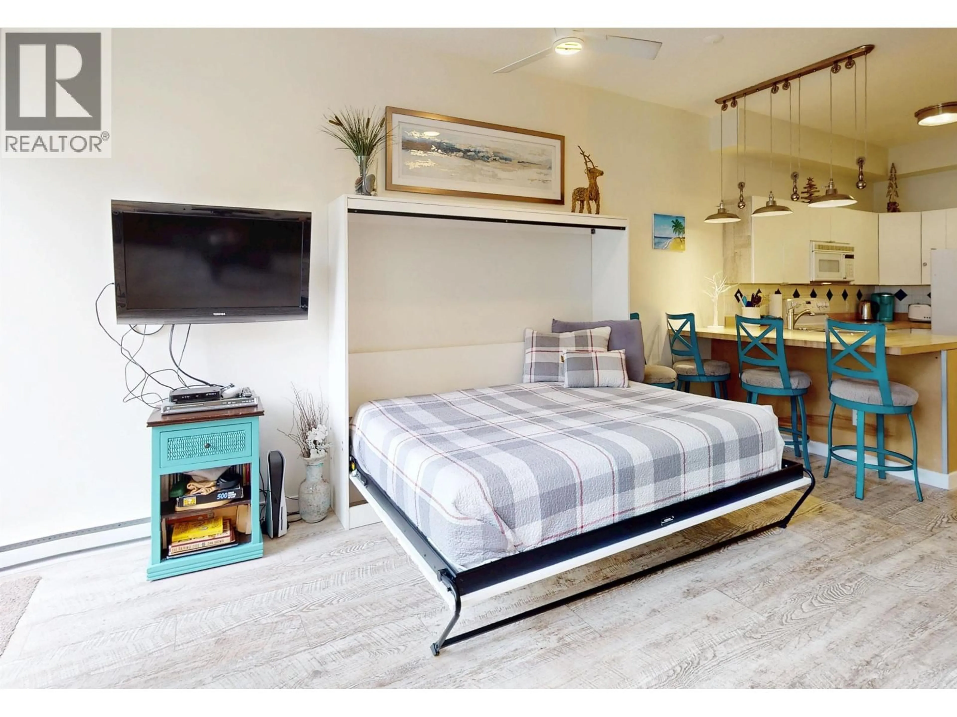 Bedroom with bed, wood/laminate floor for 303 - 4368 MAIN STREET, Whistler British Columbia V8E1B6
