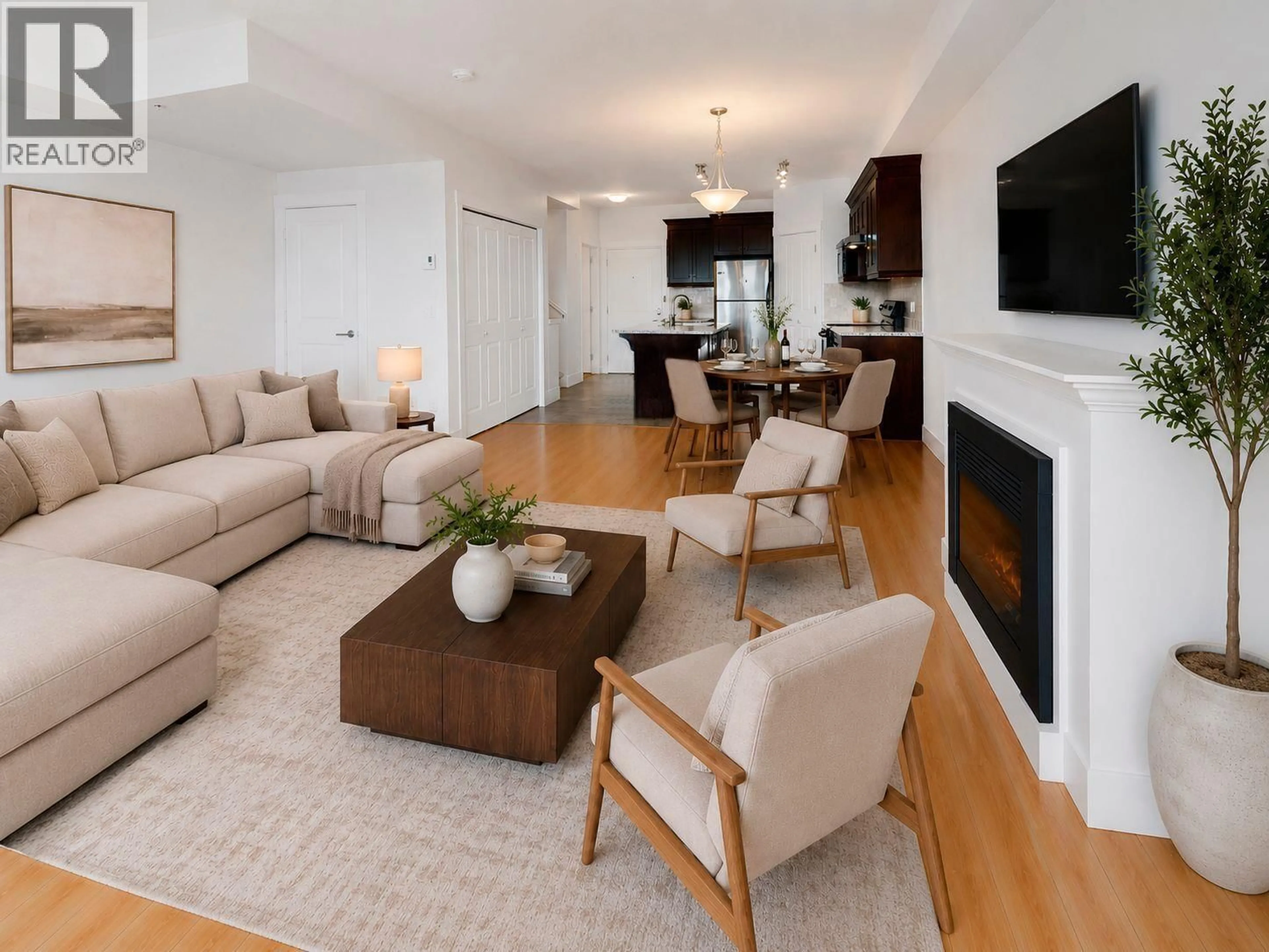 Living room with furniture, wood/laminate floor for 205 - 7908 GRAHAM AVENUE, Burnaby British Columbia V3N1V9