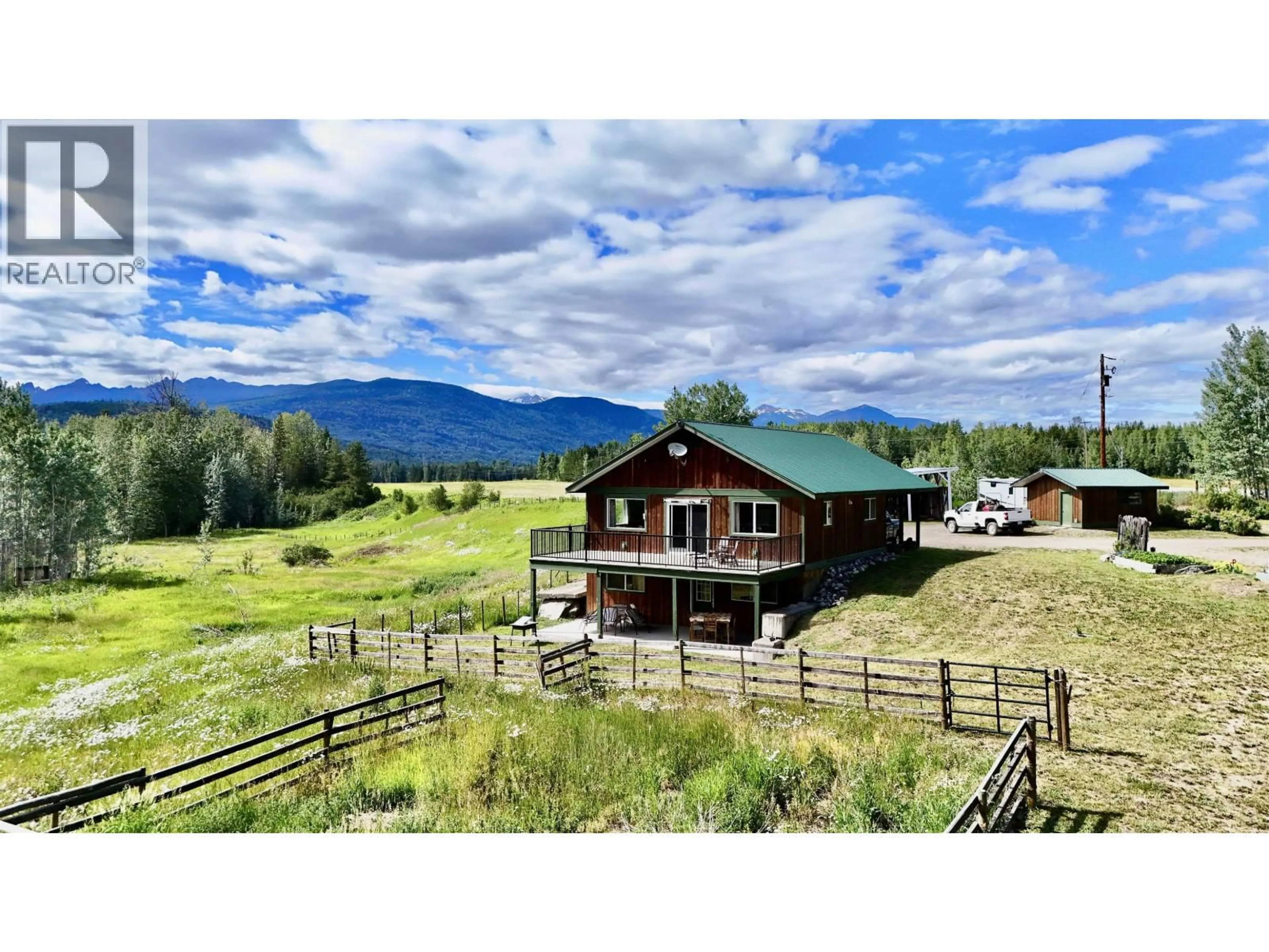 A pic from outside/outdoor area/front of a property/back of a property/a pic from drone, mountain view for 23033 16 HIGHWAY, Smithers British Columbia V0J2N1