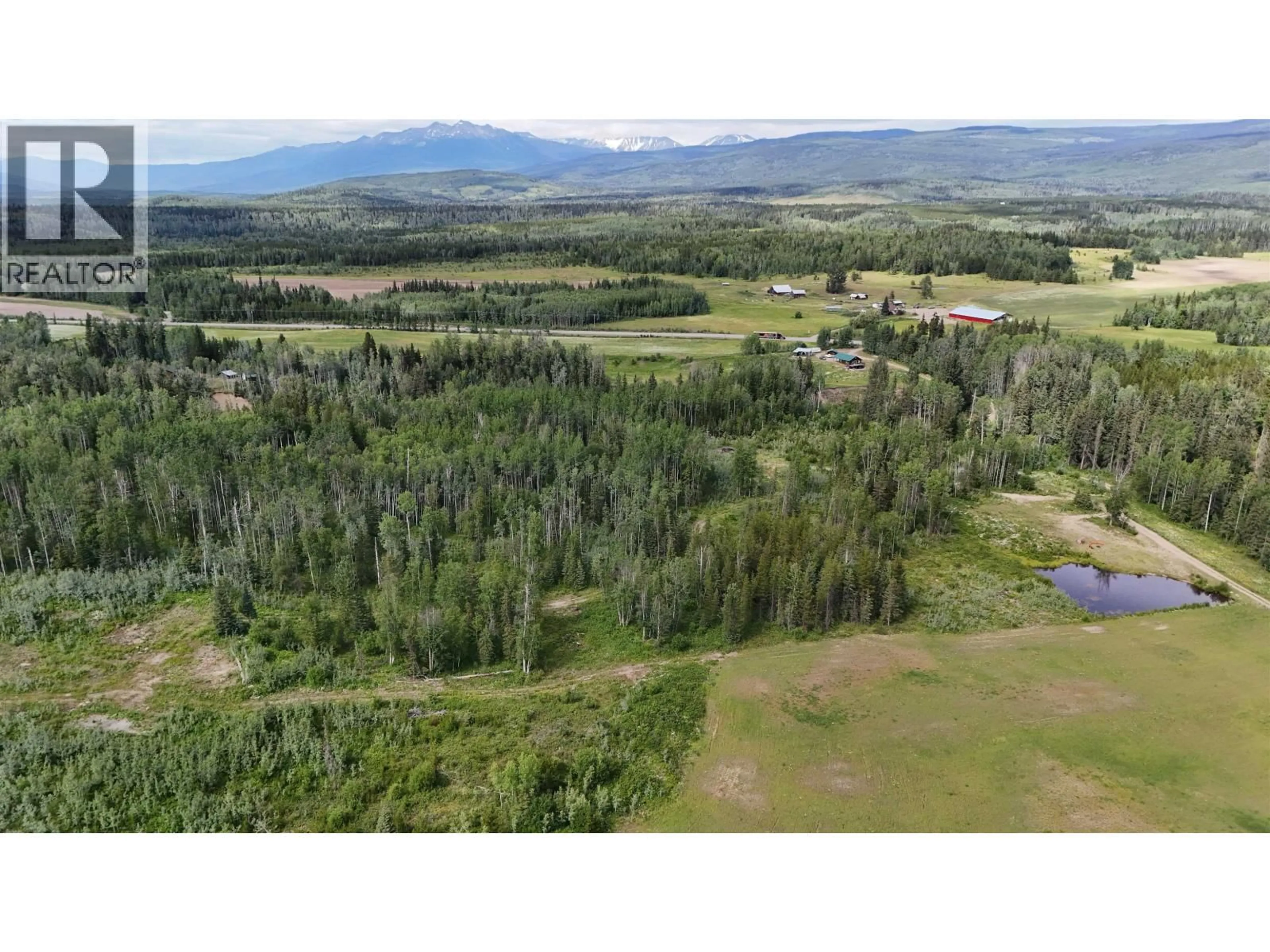 A pic from outside/outdoor area/front of a property/back of a property/a pic from drone, forest/trees view for 23033 16 HIGHWAY, Smithers British Columbia V0J2N1