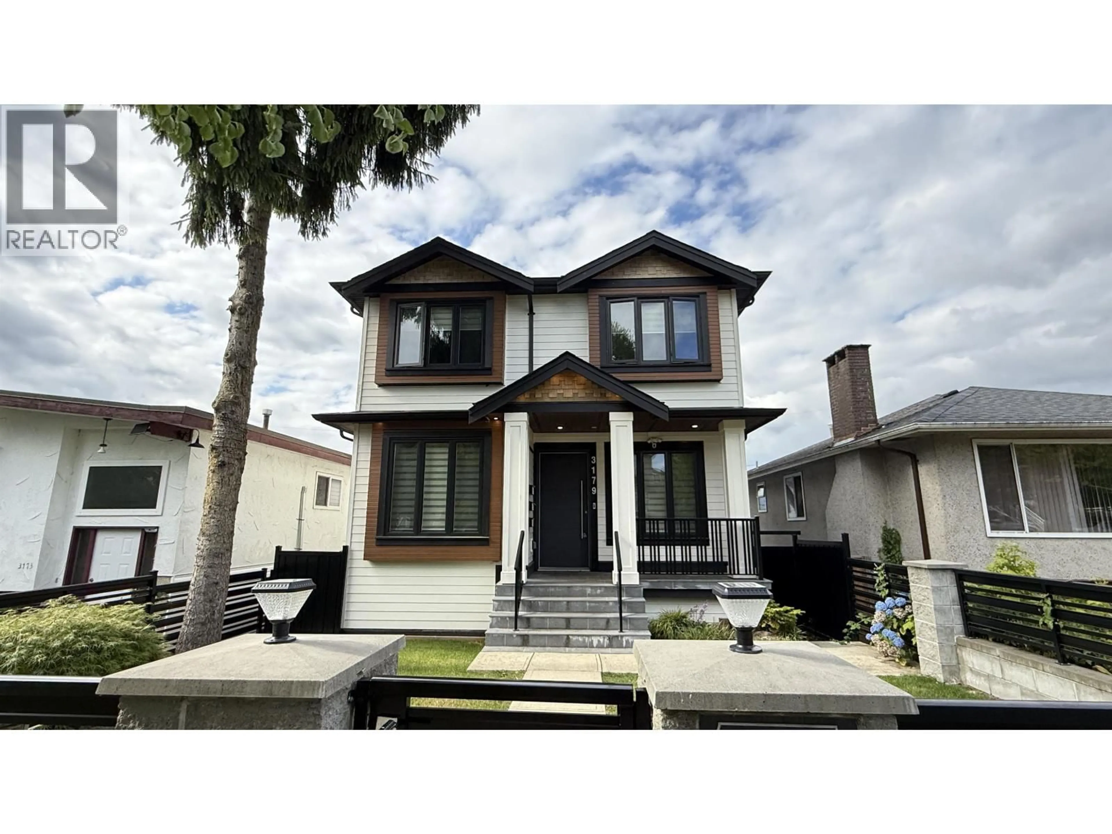Home with vinyl exterior material, street for 3179 16TH AVENUE, Vancouver British Columbia V5M2M7