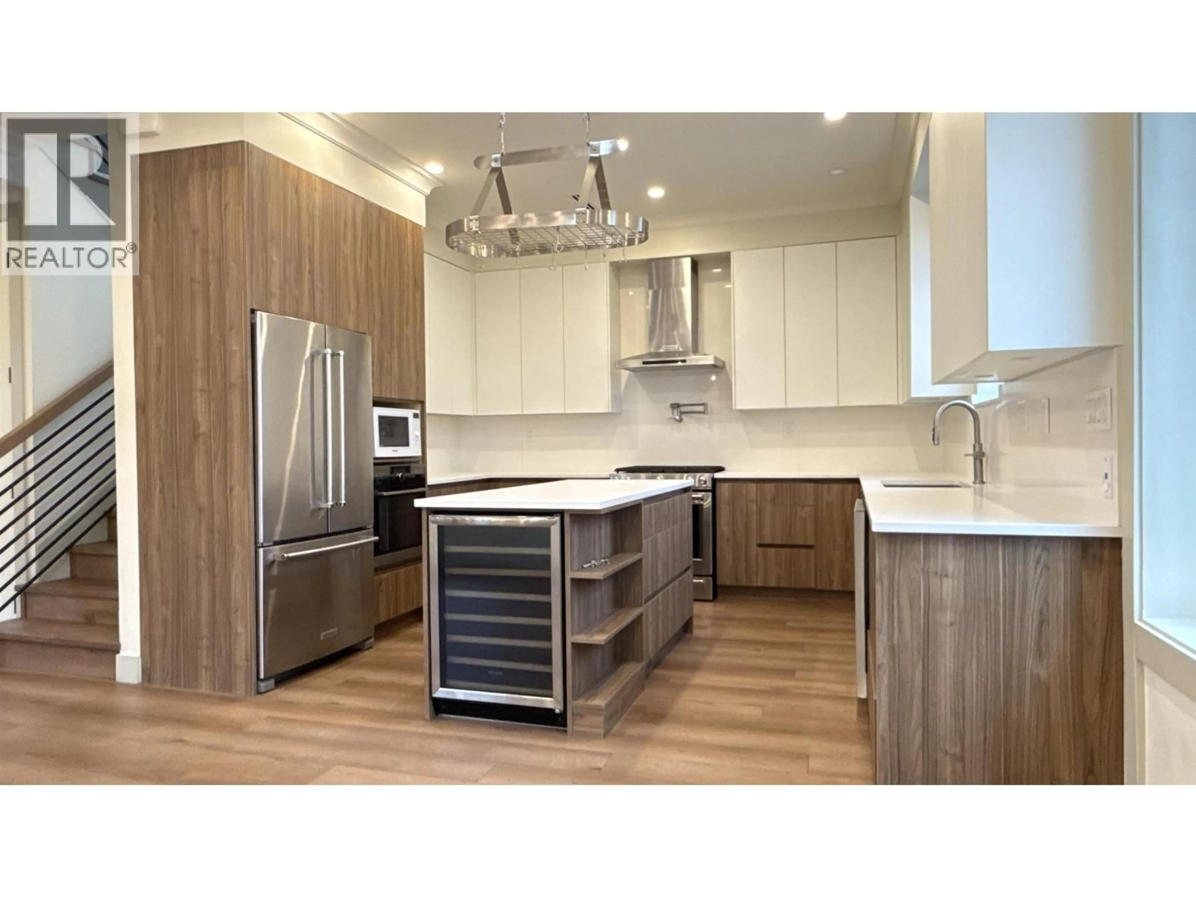 Contemporary kitchen, wood/laminate floor for 3179 16TH AVENUE, Vancouver British Columbia V5M2M7