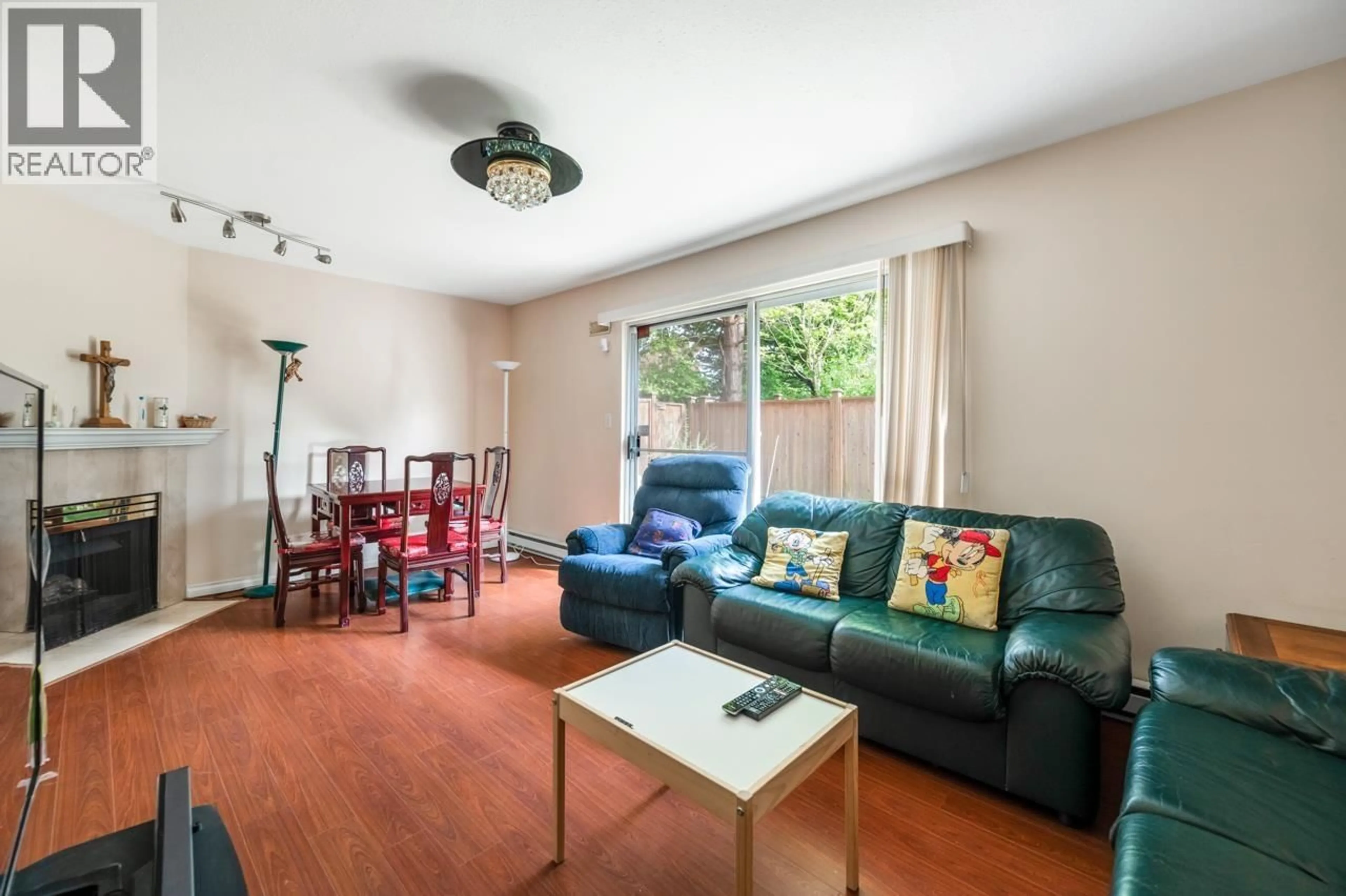 Living room with furniture, wood/laminate floor for 23 - 8780 BENNETT ROAD, Richmond British Columbia V6Y1N7